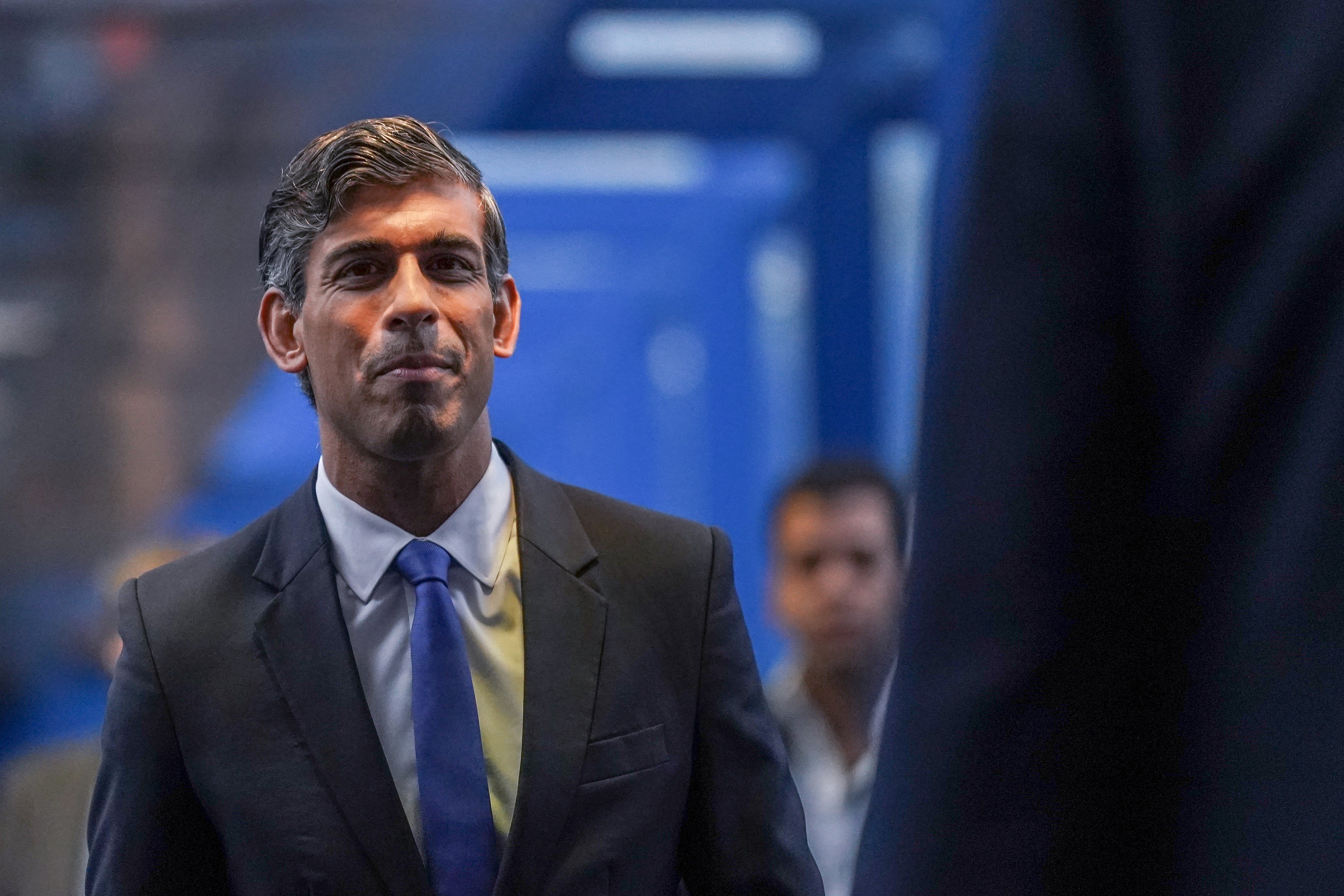 Rishi Sunak, Leader of the Conservative party walks to attend a reception for party members at the Conservative Party Conference at Birmingham