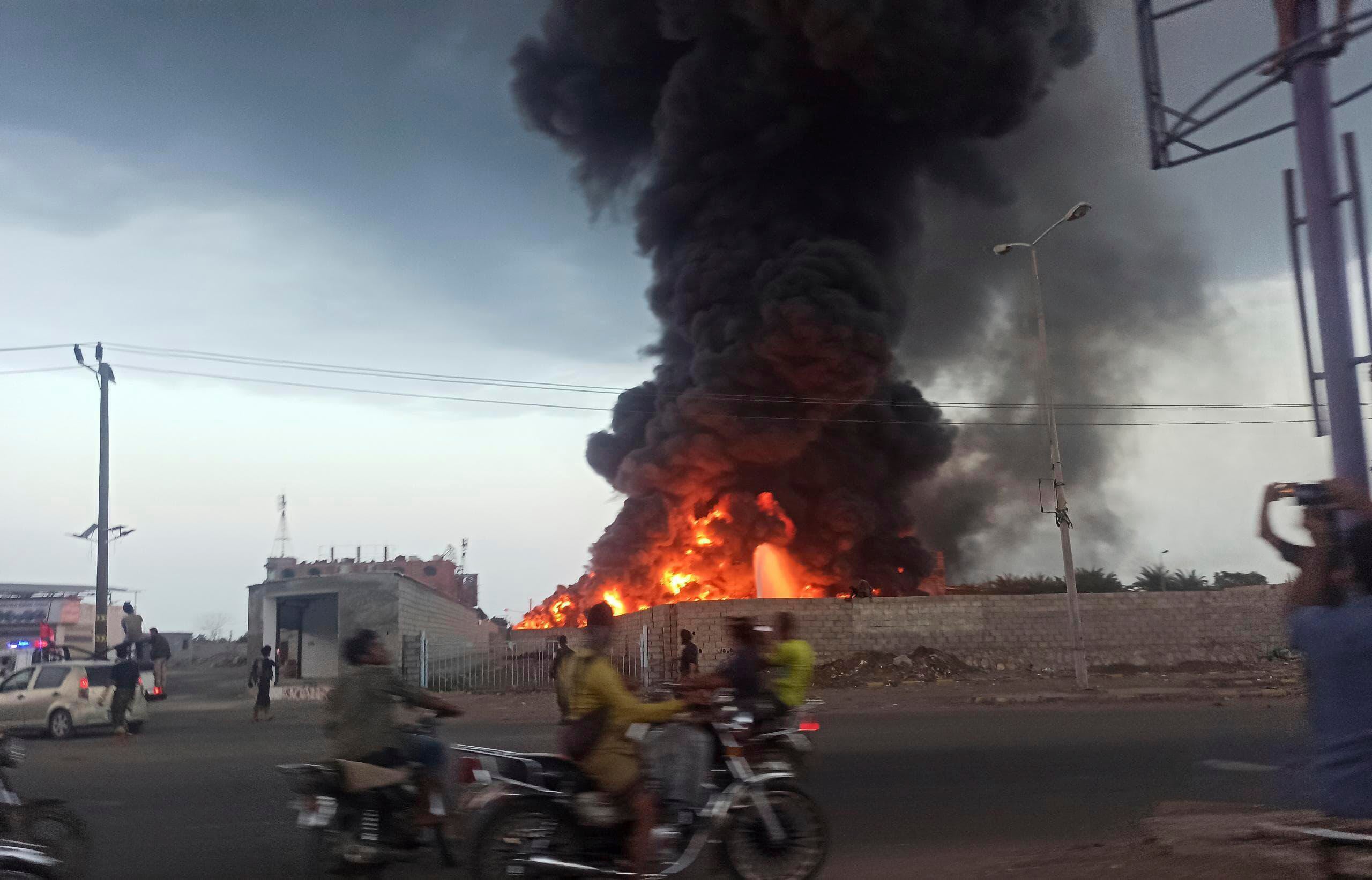 A large fire and plume of smoke is visible in the port city of Hodeida, Yemen,