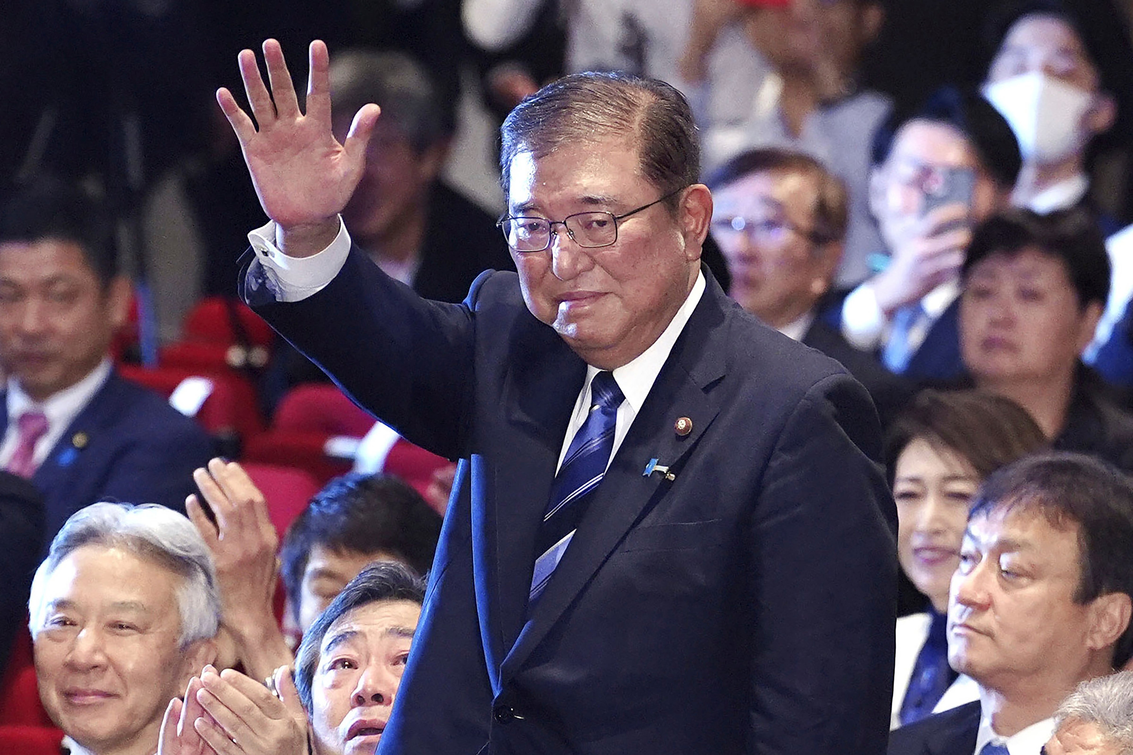 Shigeru Ishiba, centre, waves as he is elected as leader of the ruling Liberal Democratic Party after the party’s leadership election, in Tokyo Friday, 27 September 2024