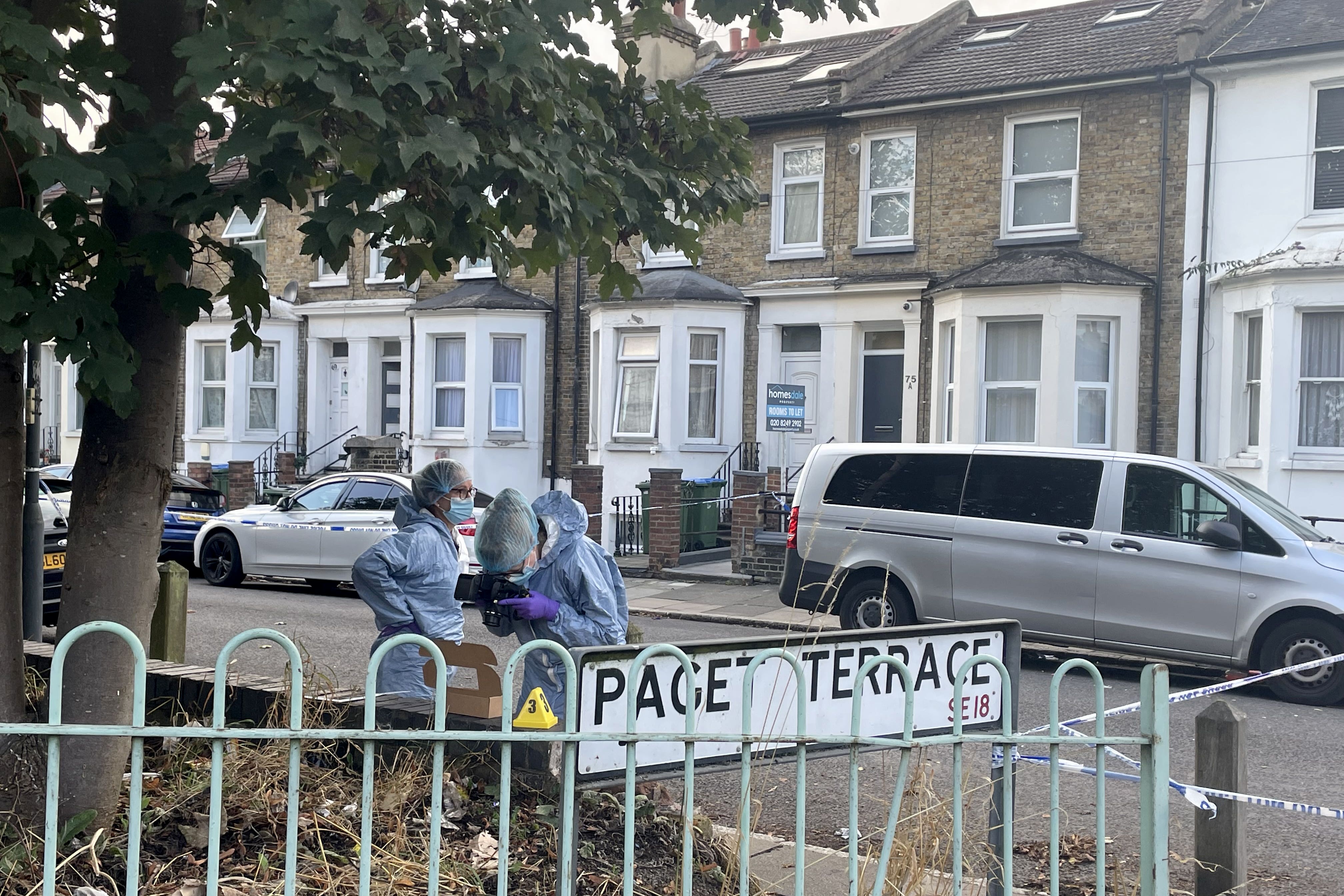 Forensics officers at the scene on Paget Terrace, near the scene in Eglinton Road, Woolwich, south-east London (PA)