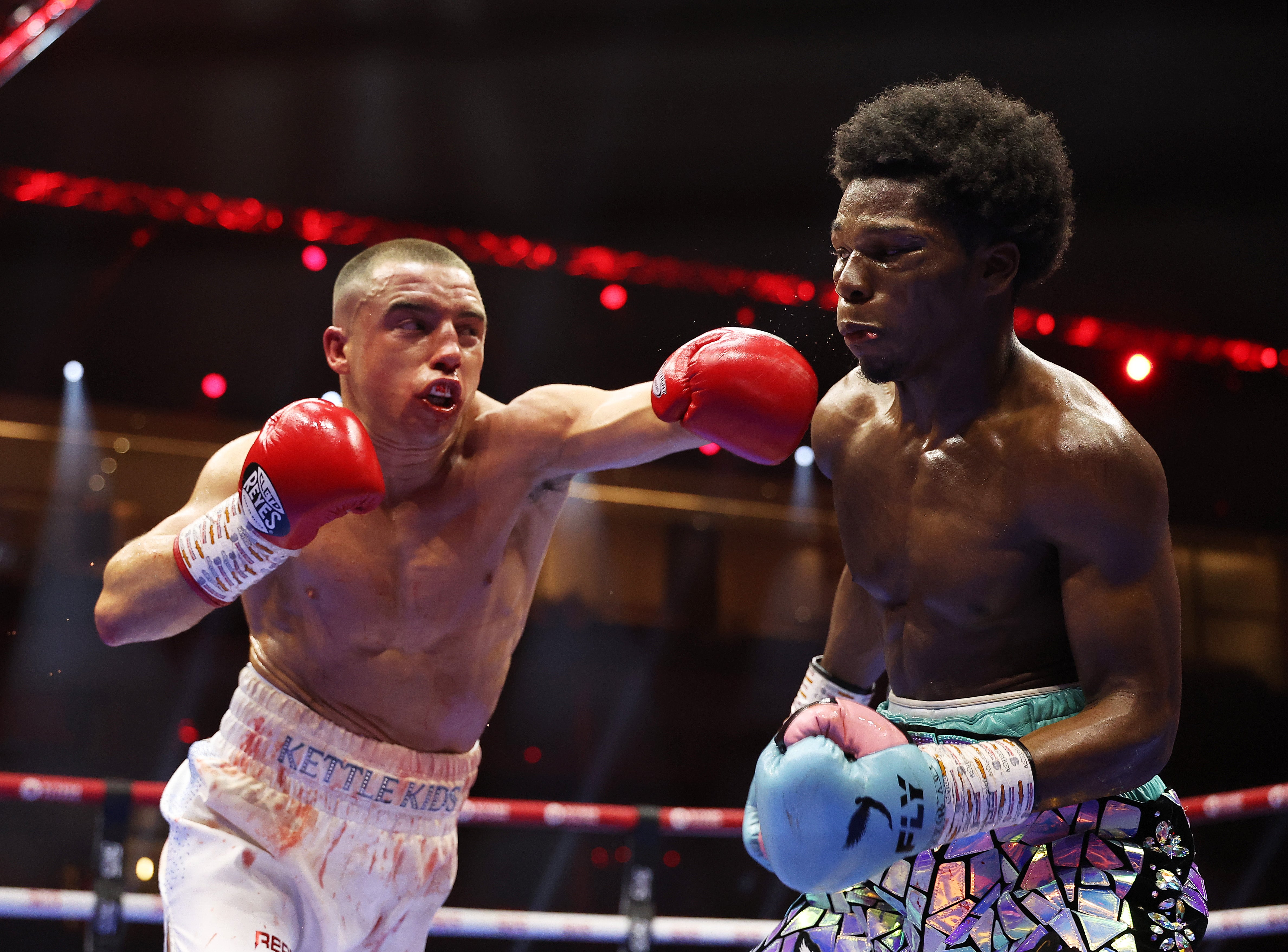 Nick Ball of Team Queensberry punches Raymond Ford of Team Matchroom