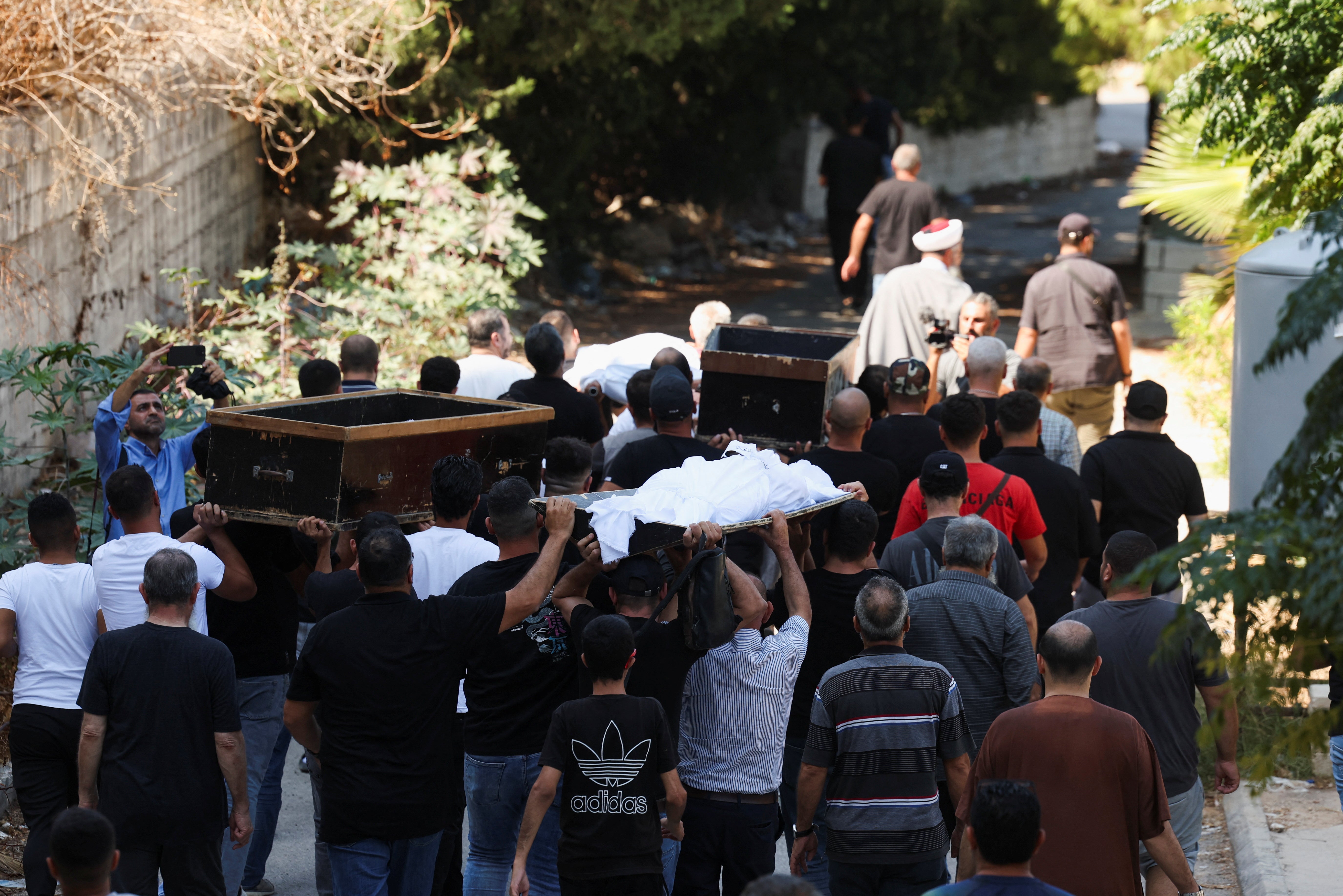 Mourners attend the funeral of people killed in an Israeli attack on Sunday in the city of Ain Deleb in southern Lebanon