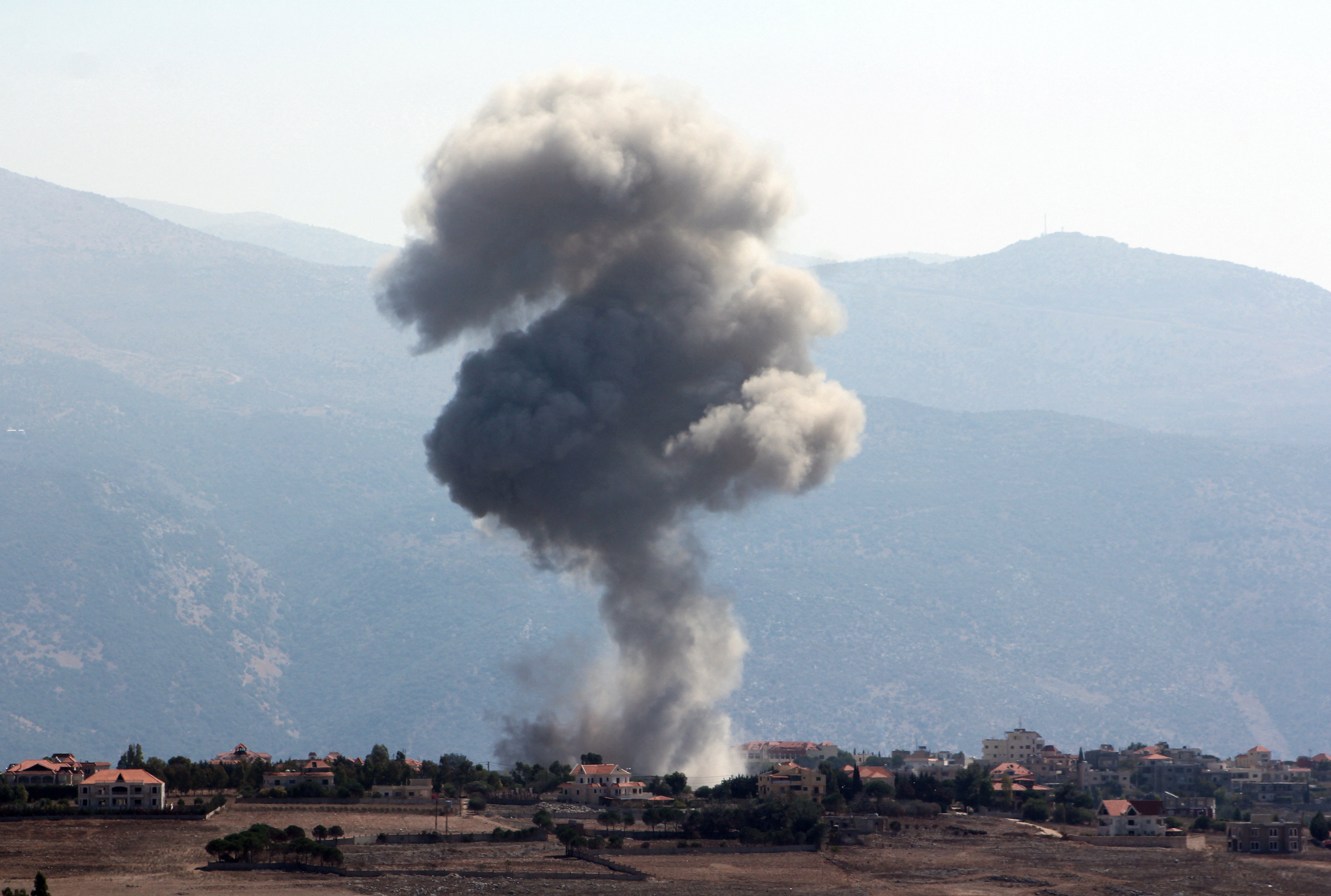 Smoke billows over Khiam, amid ongoing cross-border hostilities between Hezbollah and Israeli forces, as pictured from Marjayoun, near the Lebanese border with Israel