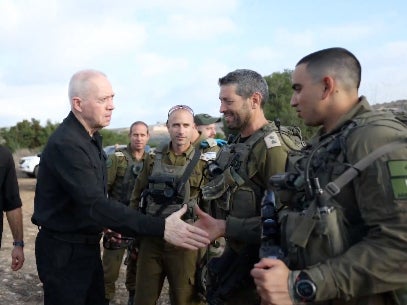 Israel defence minister Yoav Gallant greets troops from the 188th bridgade on the northern border with Lebanon