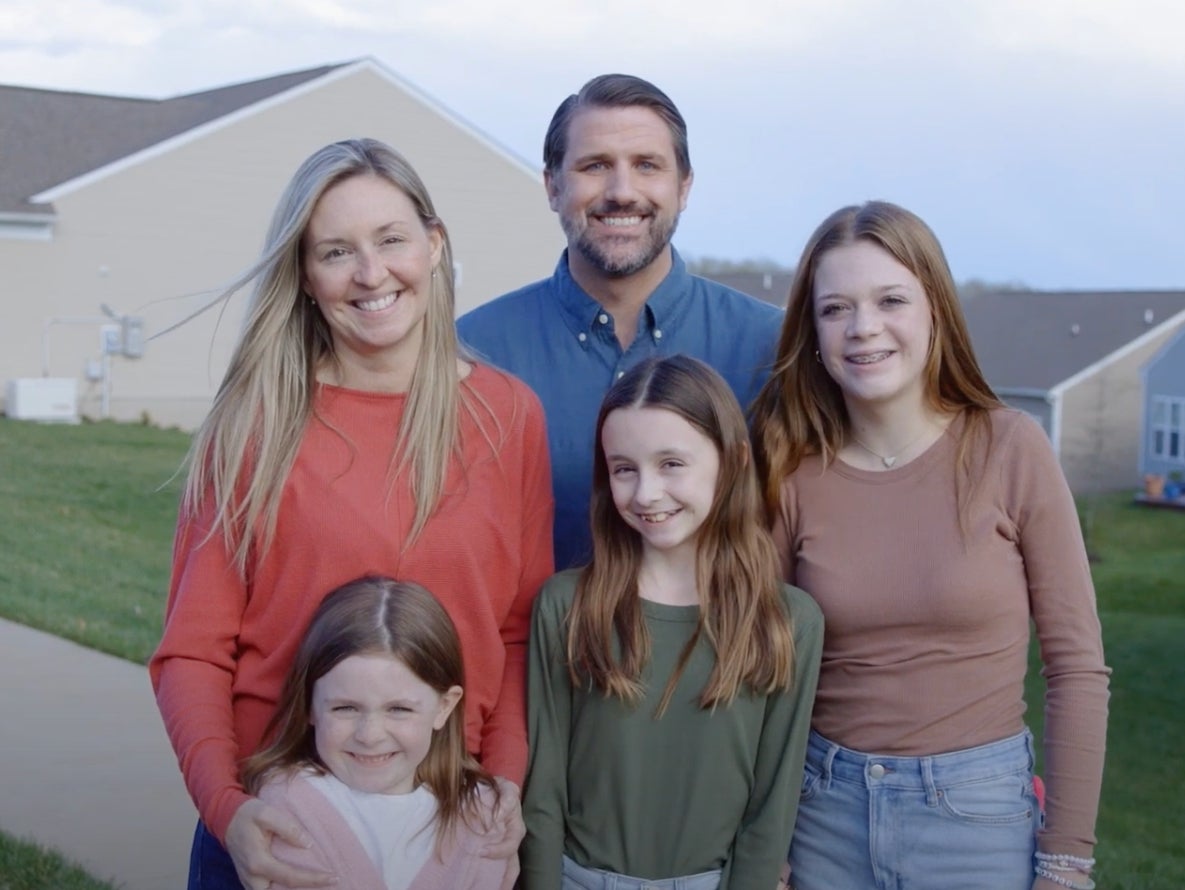 Virginia congressional candidate Derrick Anderson poses for a photo to promote his campaign. These people are not his family