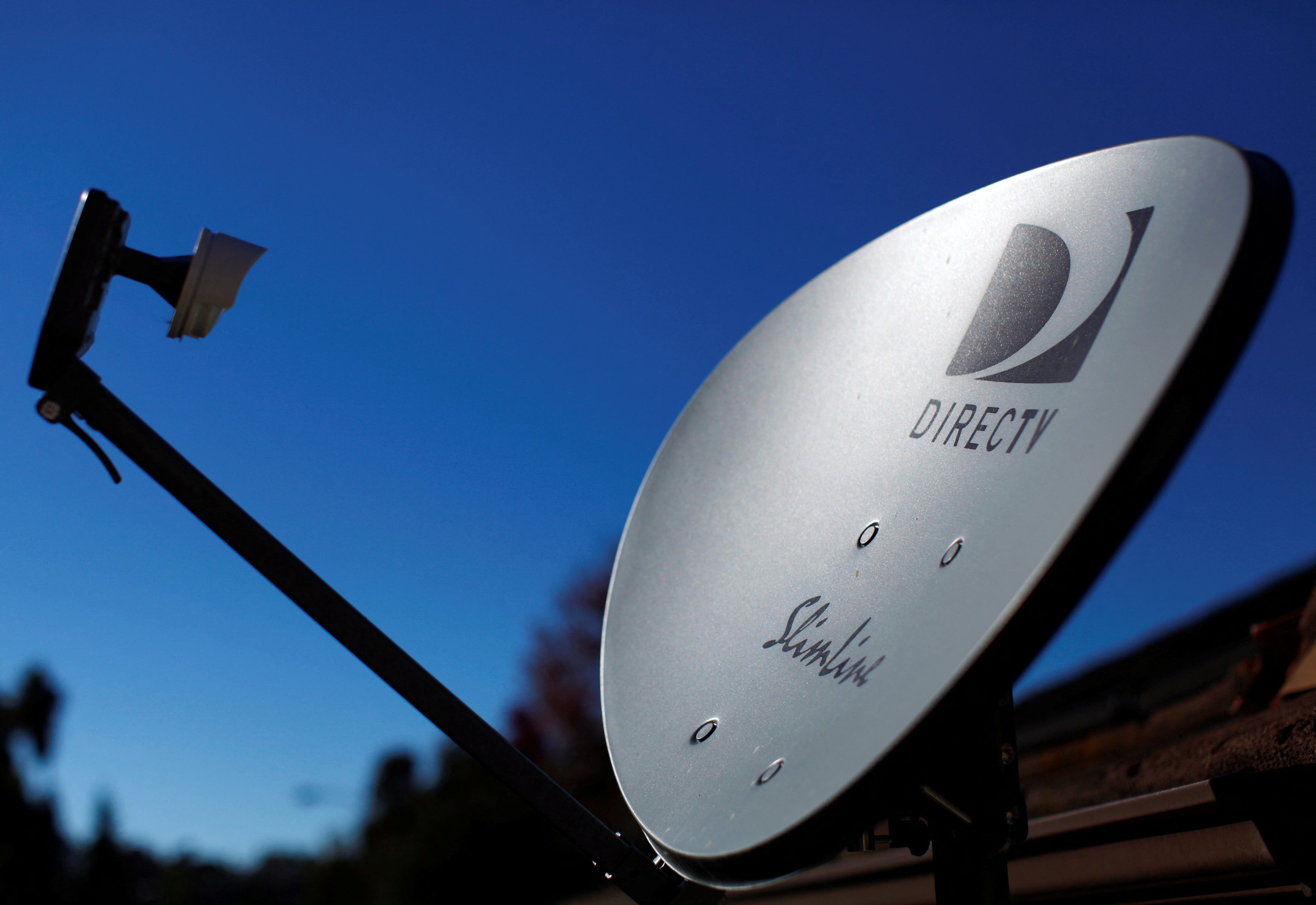 DirecTV is buying rival Dish Network for $1 as part of a major shift for the satellite provider