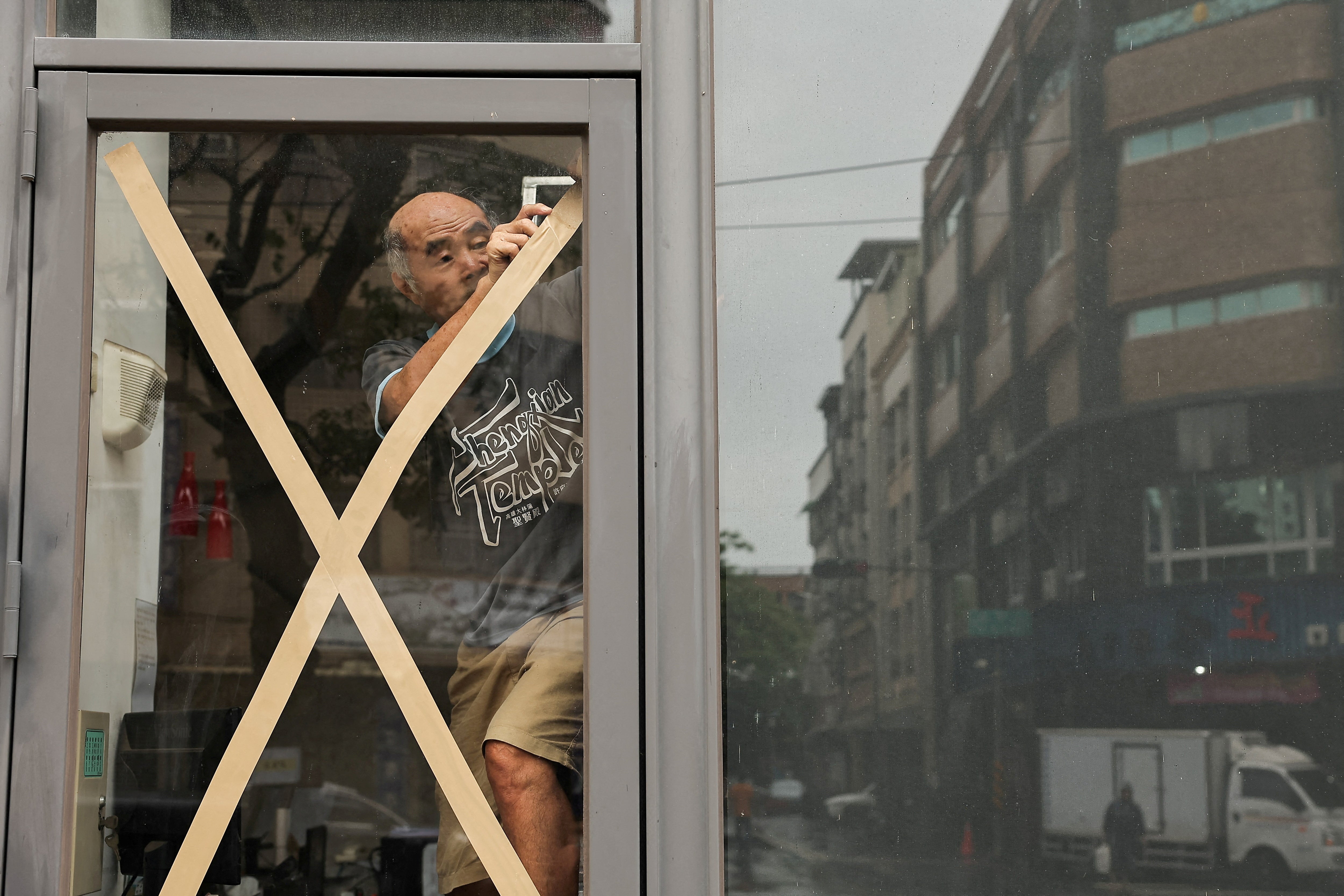 A resident prepares for Typhoon Krathon, in Kaohsiung, Taiwan