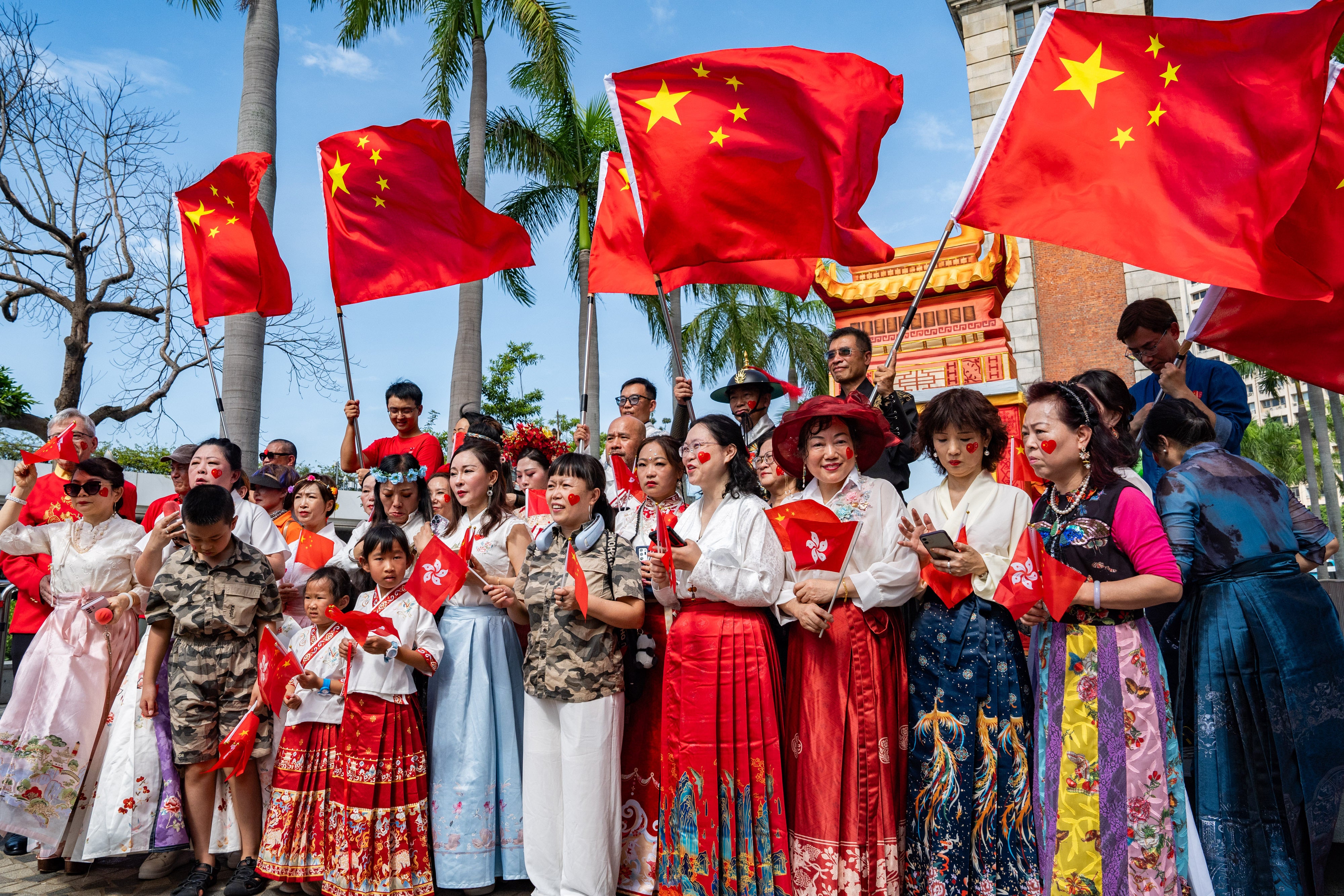 People wave Chinese flag to celebrate the 75th anniversary of China's National Day