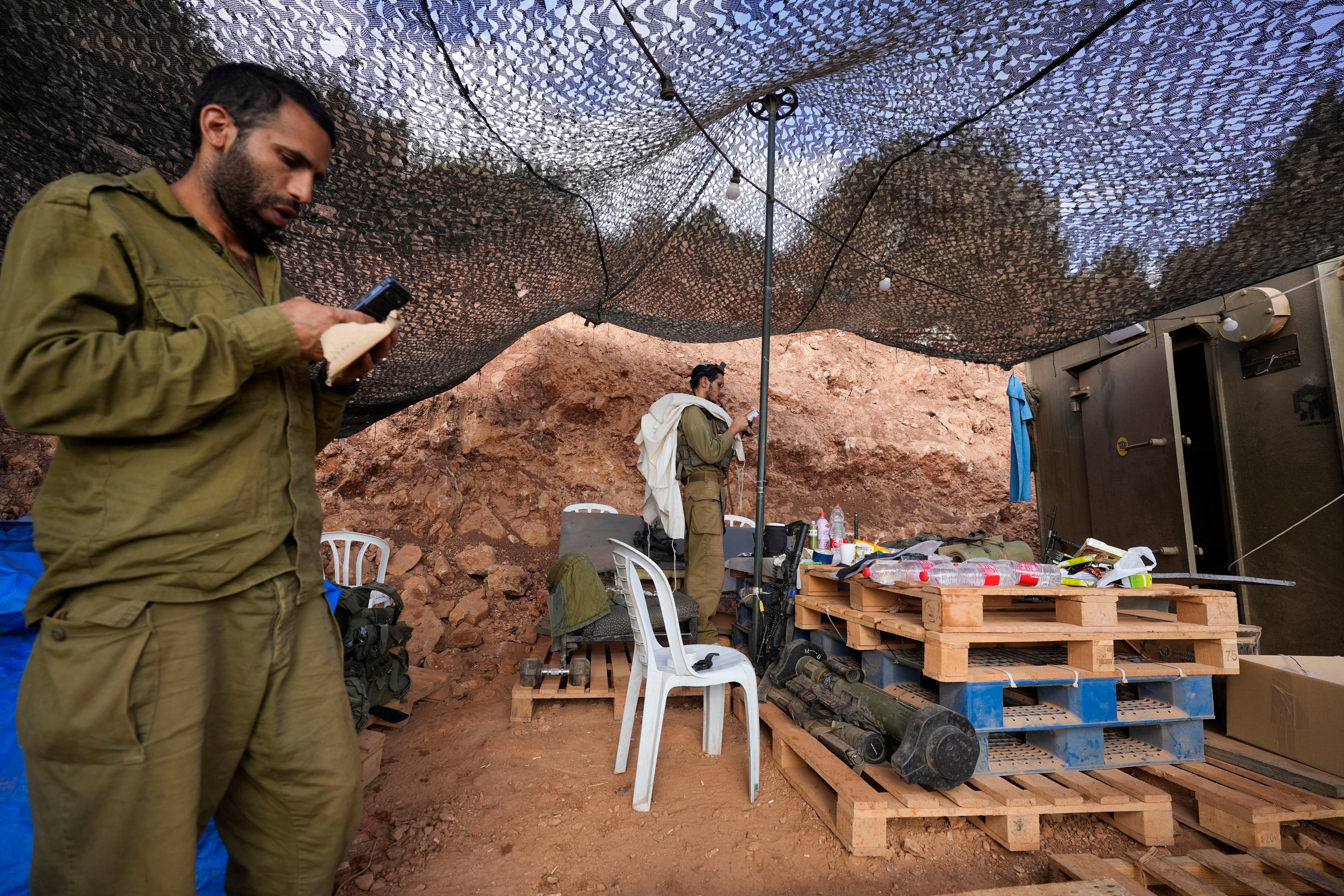 Israeli soldiers pray at a staging area in northern Israel near the Israel-Lebanon border,