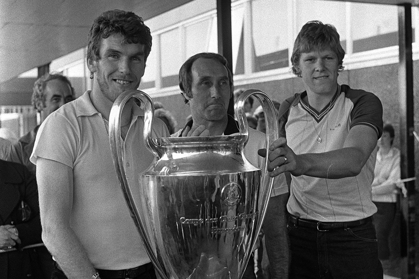 Tony Barton (centre) managed Aston Villa to European Cup glory in 1982 and is seen posing with the trophy alongside Peter Withe (left) and goalkeeper Nigel Spinks (right)