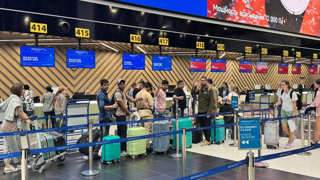 Azad Yousuf Kumar at Moscow airport with five other Indians who were released in September