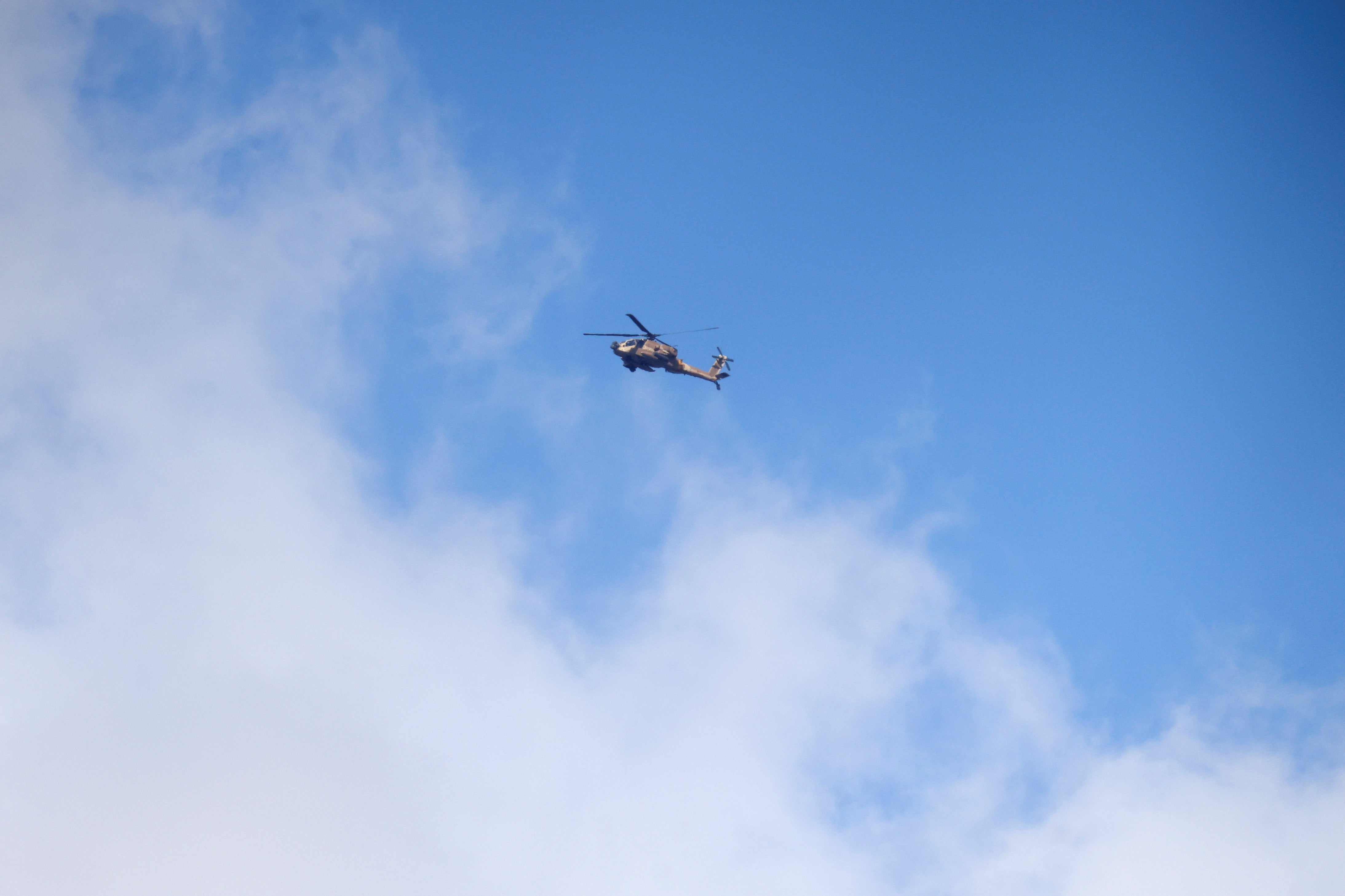 An Israeli aircraft flies near the border with Lebanon, amid cross-border hostilities between Hezbollah and Israel, as seen from northern Israel