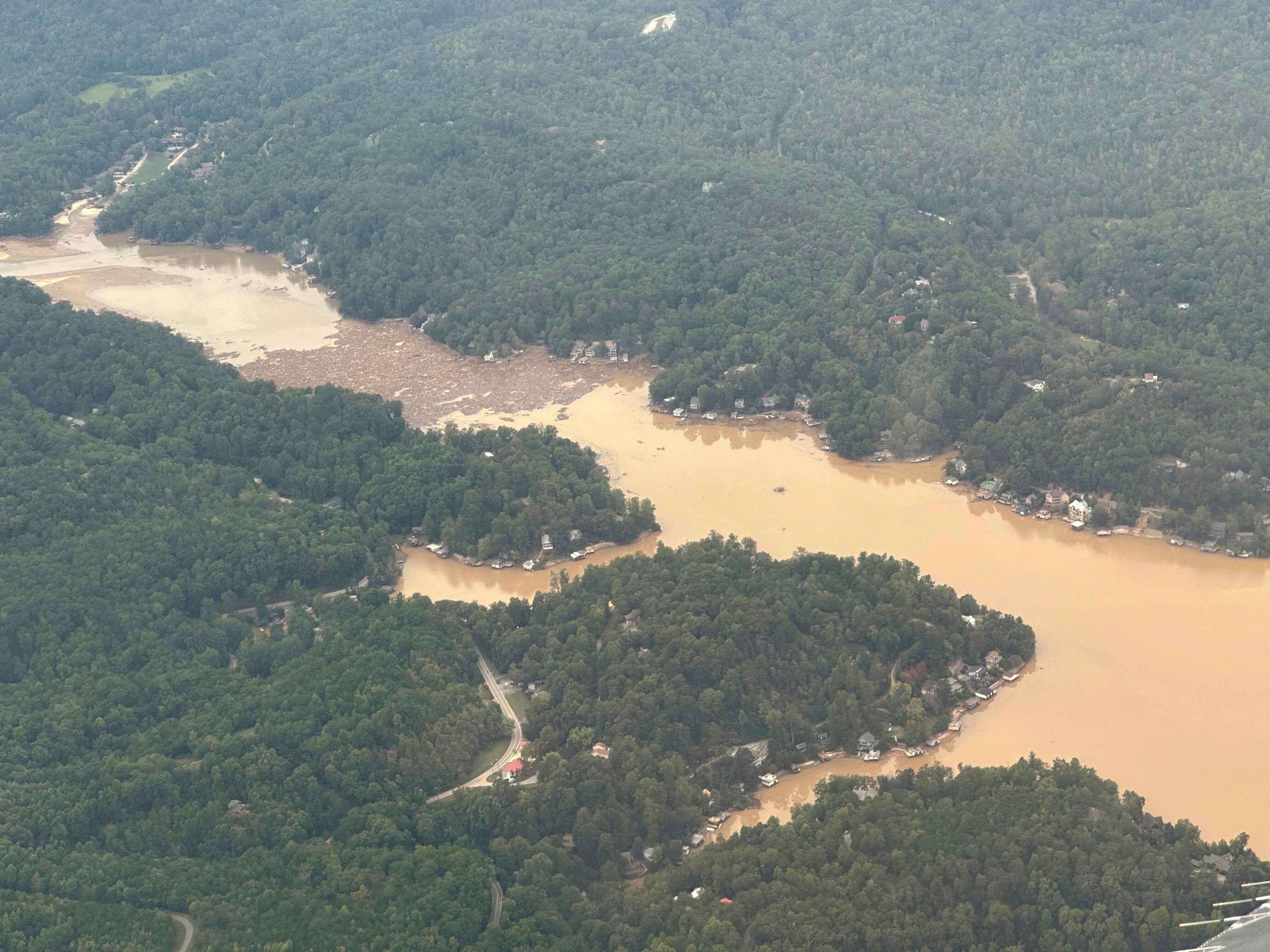 Storm debris is seen in the waters of North Carolina’s Lake Lure on Monday