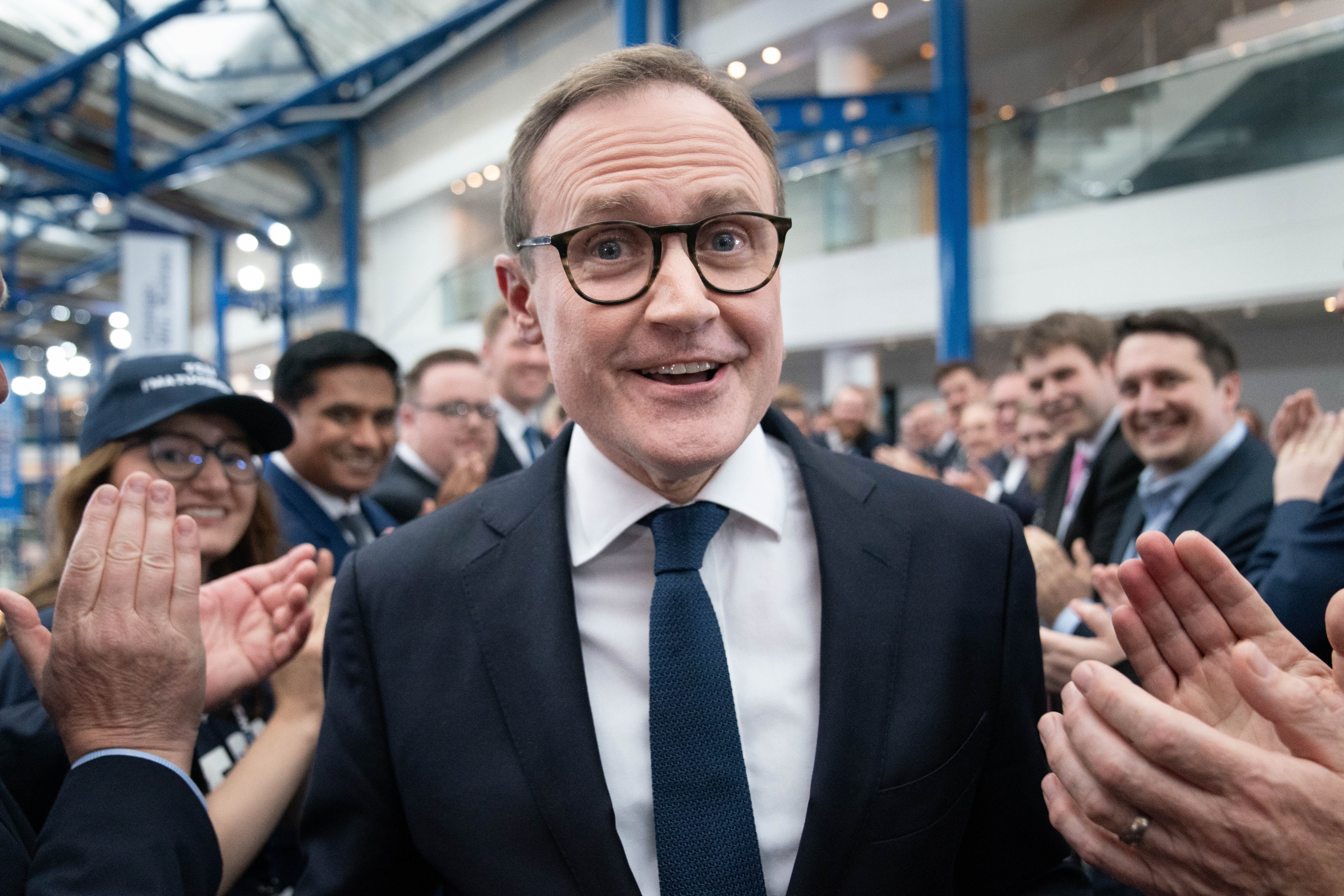 Tory leadership candidate, Tom Tugendhat walks past supporters after attending a hustings event during the Conservative Party Conference (Stefan Rousseau/PA)