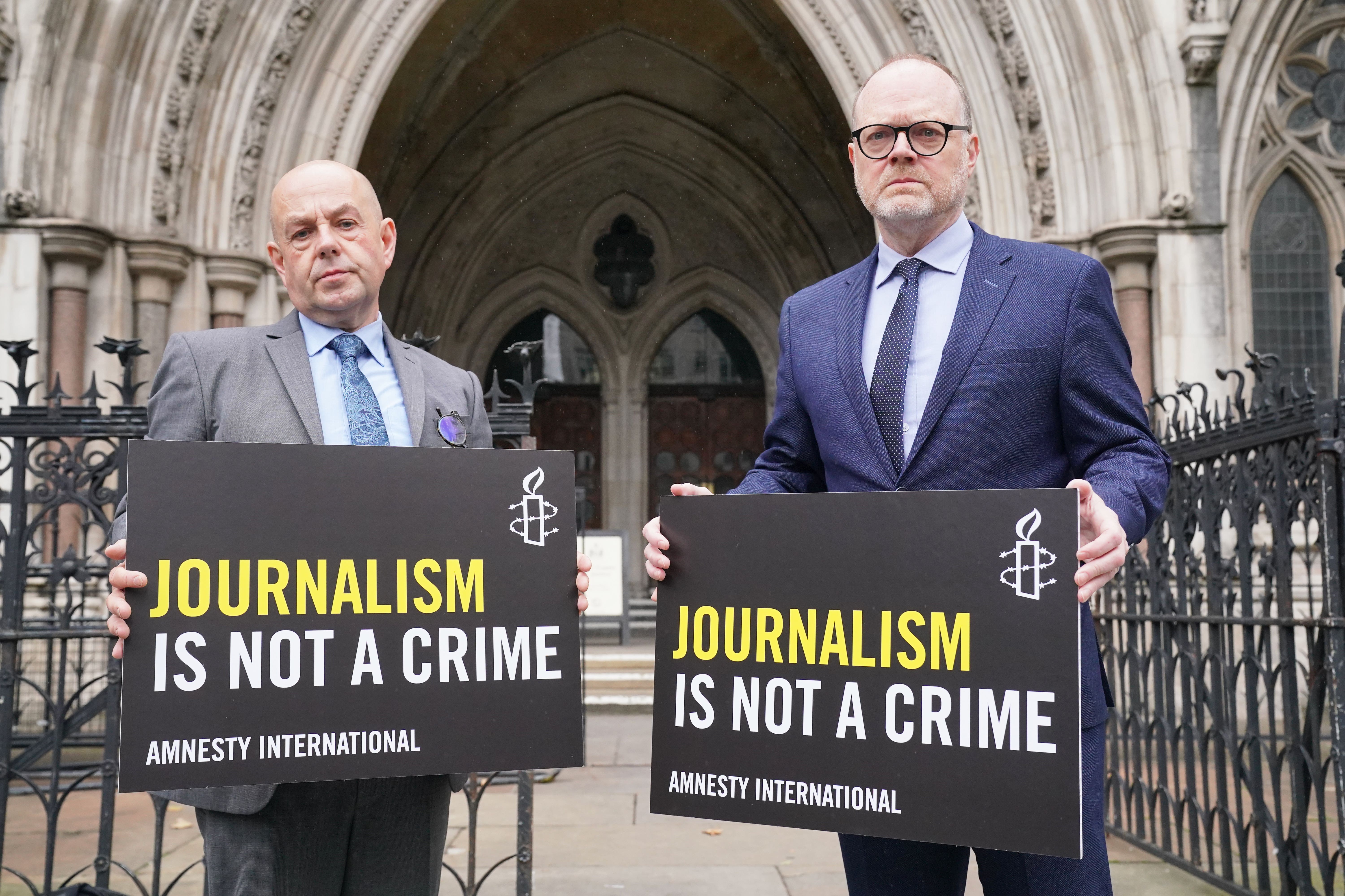 Journalists Barry McCaffrey (left) and Trevor Birney outside the Royal Courts of Justice in London (Jonathan Brady/PA)