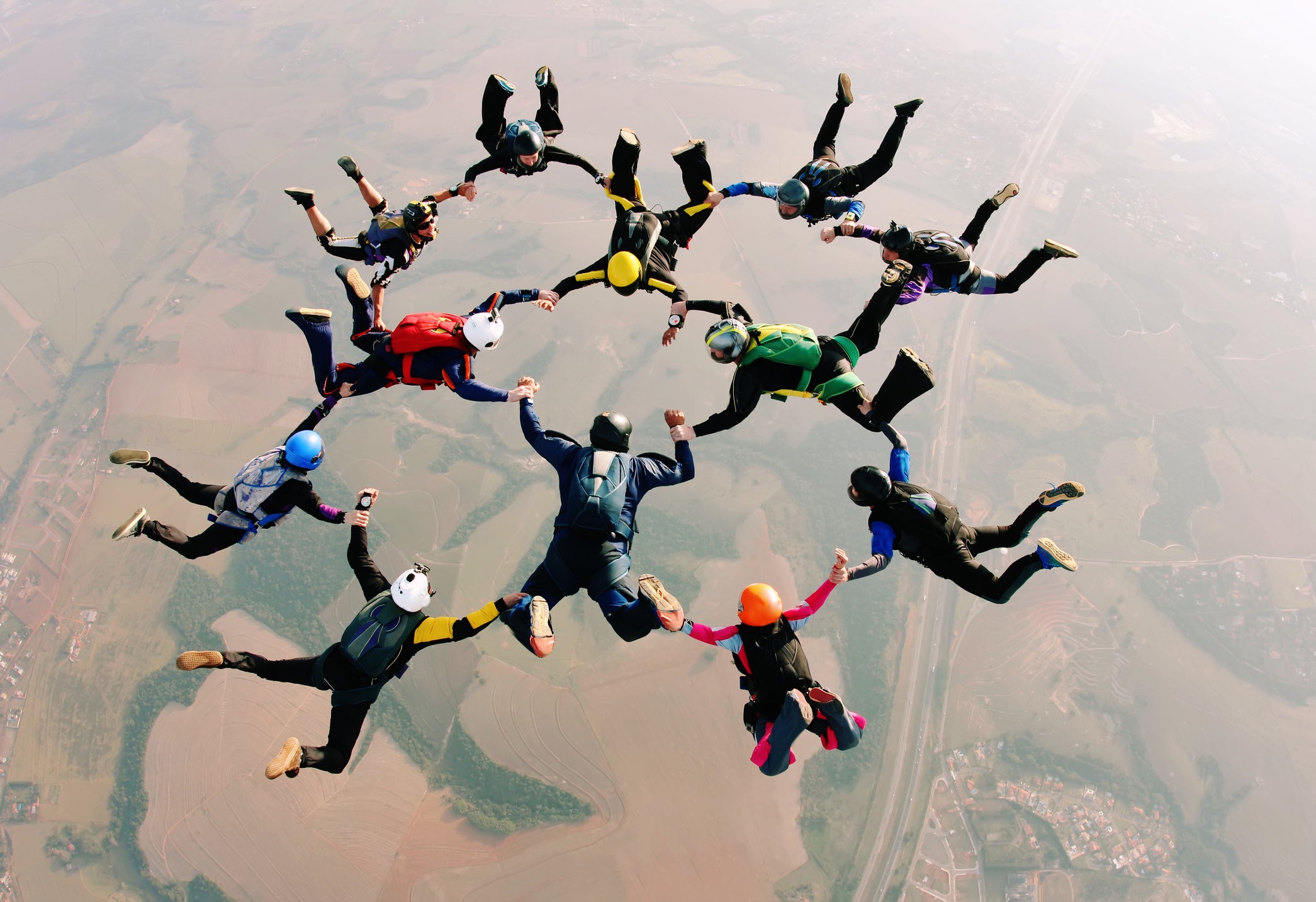 File - skydivers holding hands making a formation