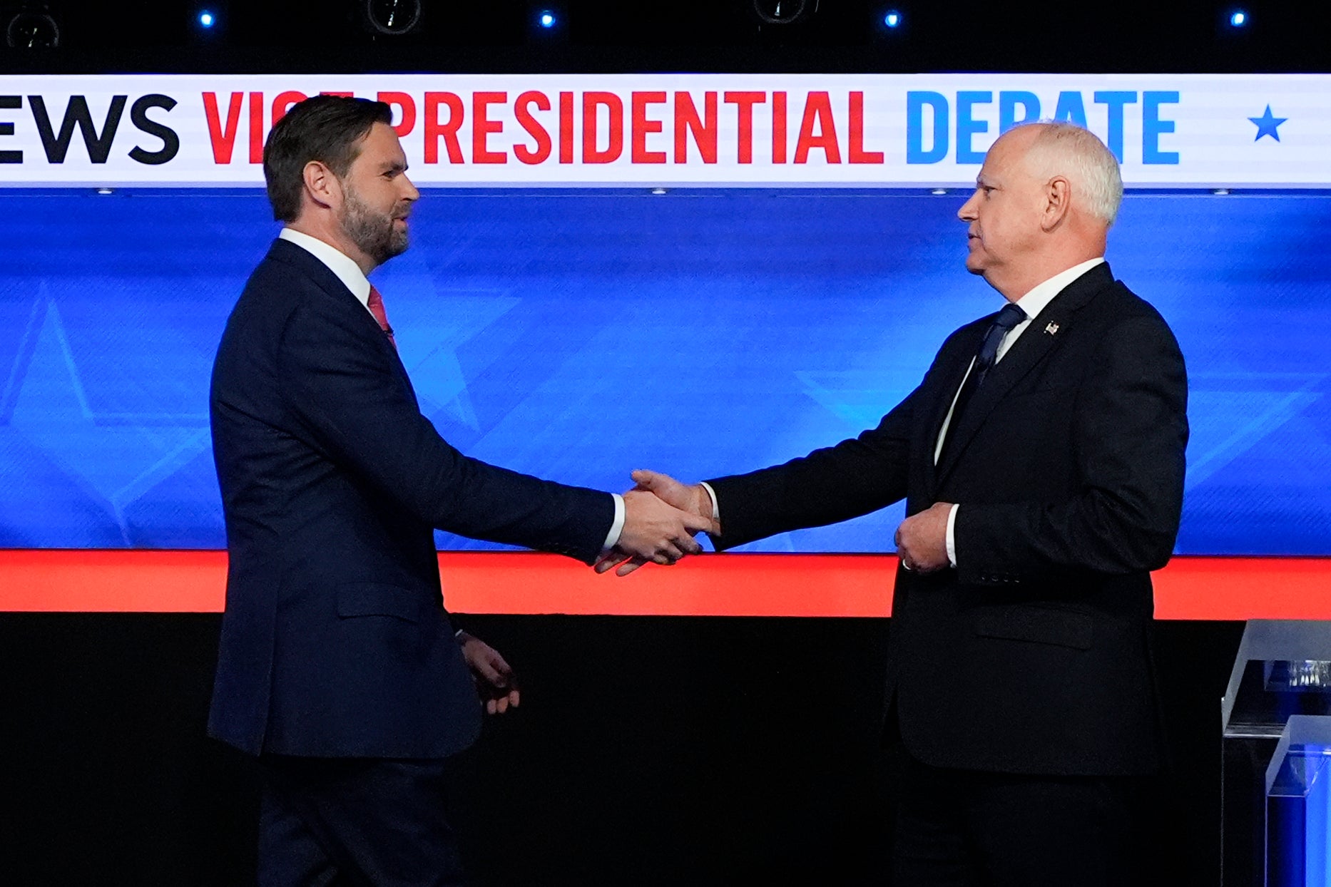 Vance and Walz shake hands upon arrival at the CBS News vice presidential debate New York City on Tuesday