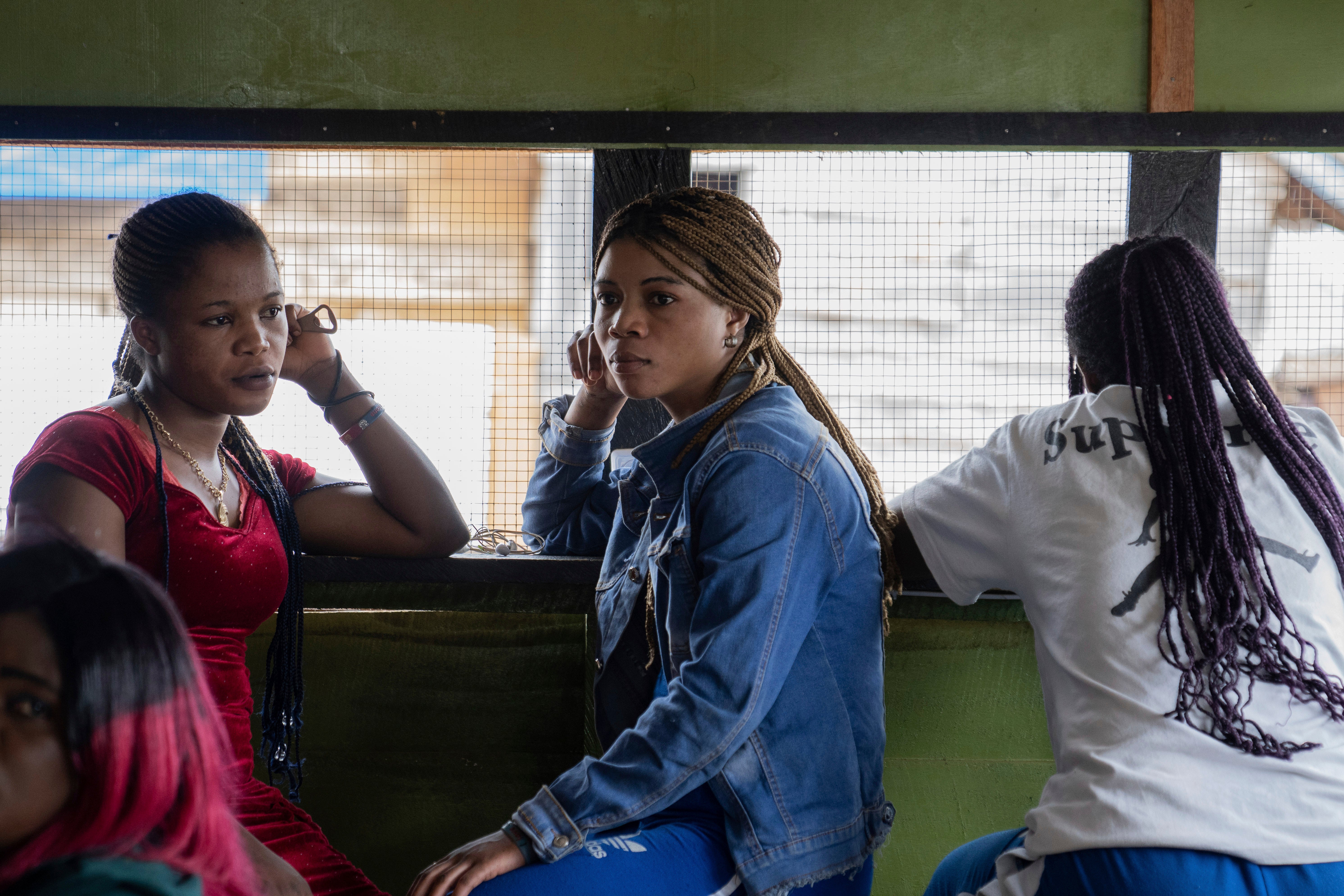 Sex workers listen to a briefing on mpox Wednesday, September 4, 2024 in a bar in Kamituga, eastern Congo