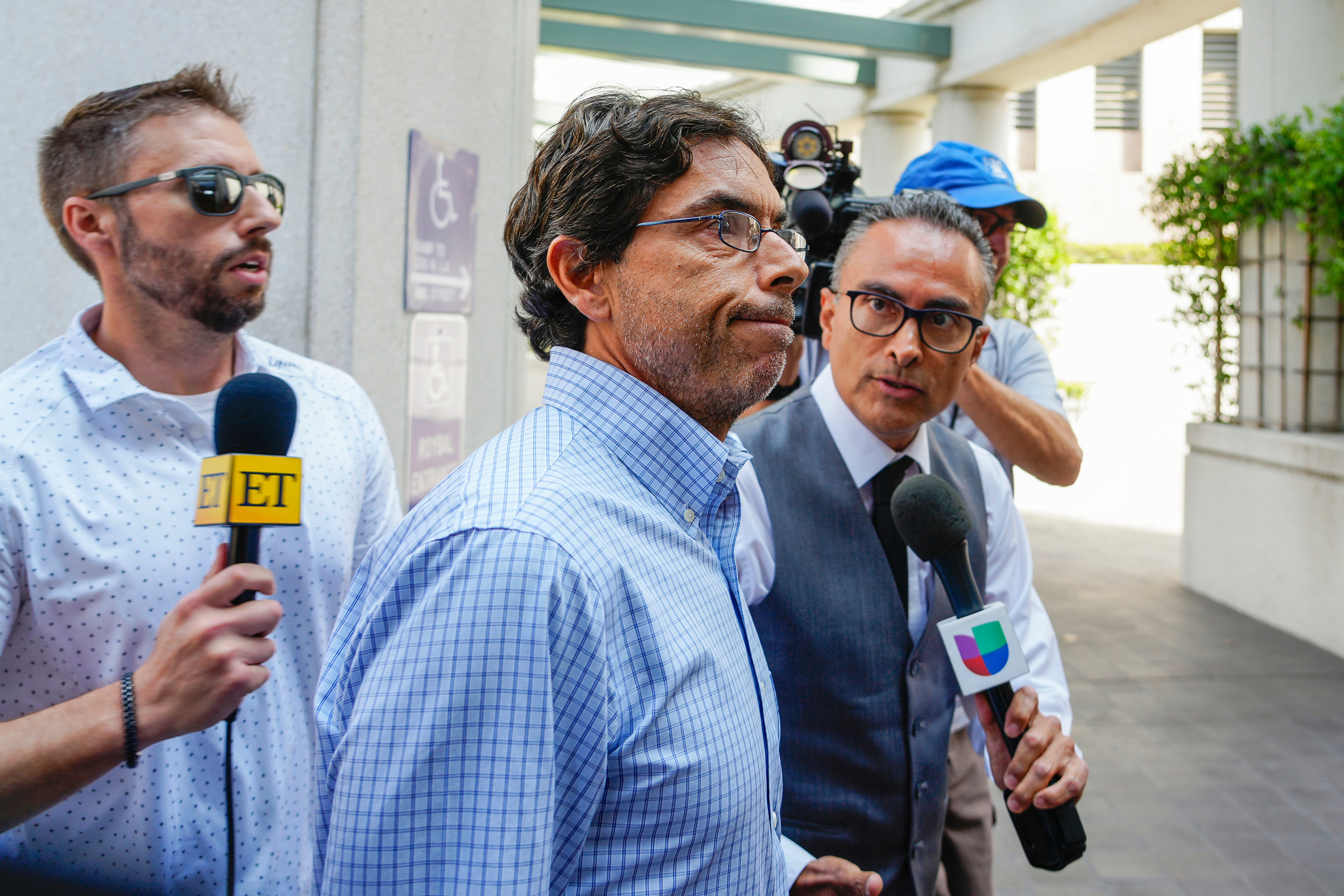 Dr. Mark Chavez, center, a physician from San Diego, who is charged in connection with actor Matthew Perry’s death