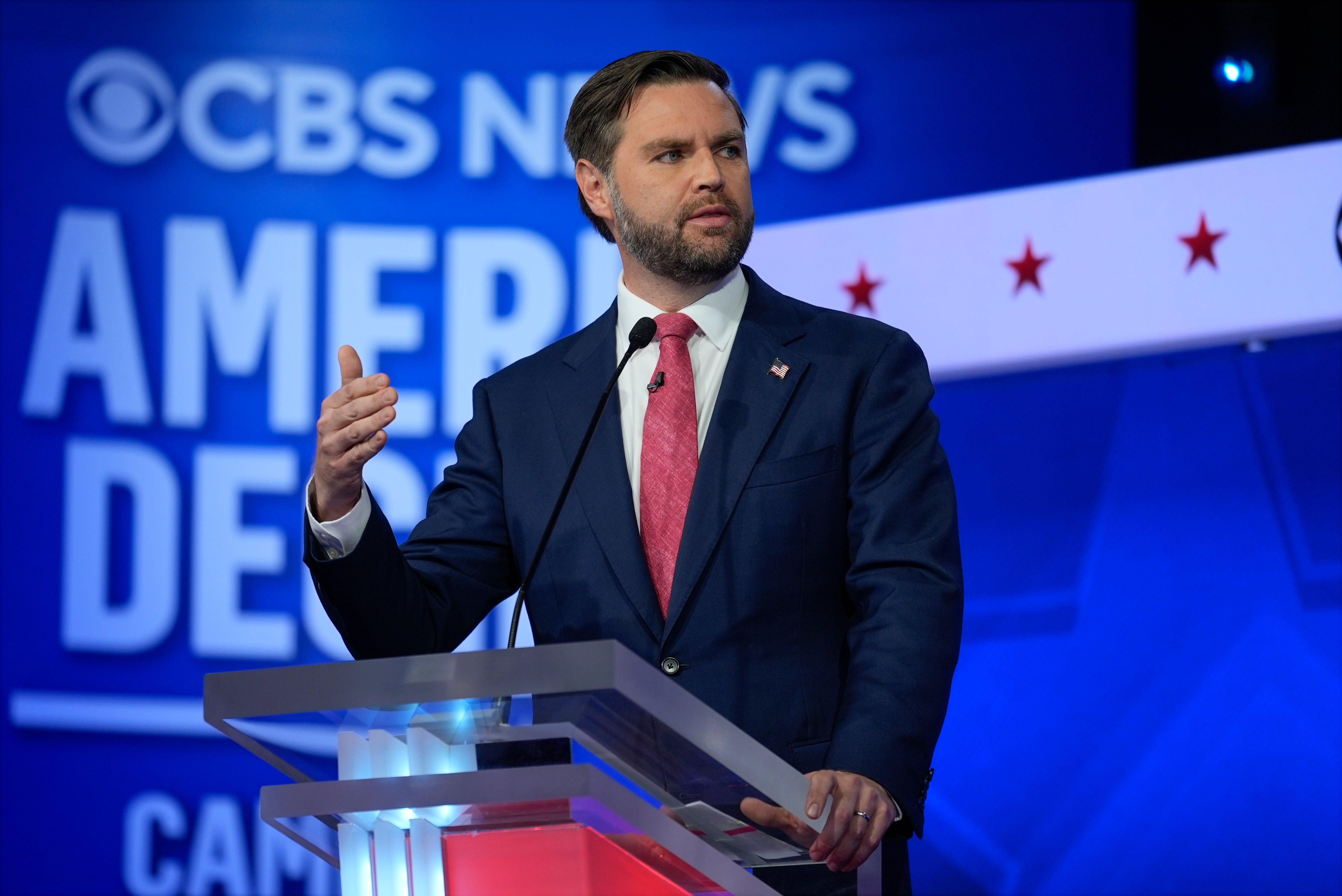 Republican vice presidential nominee JD Vance speaks on stage during the debate where the candidates answered questions on foreign policy, the climate crisis, immigration, childcare, housing, gun violence and abortion rights