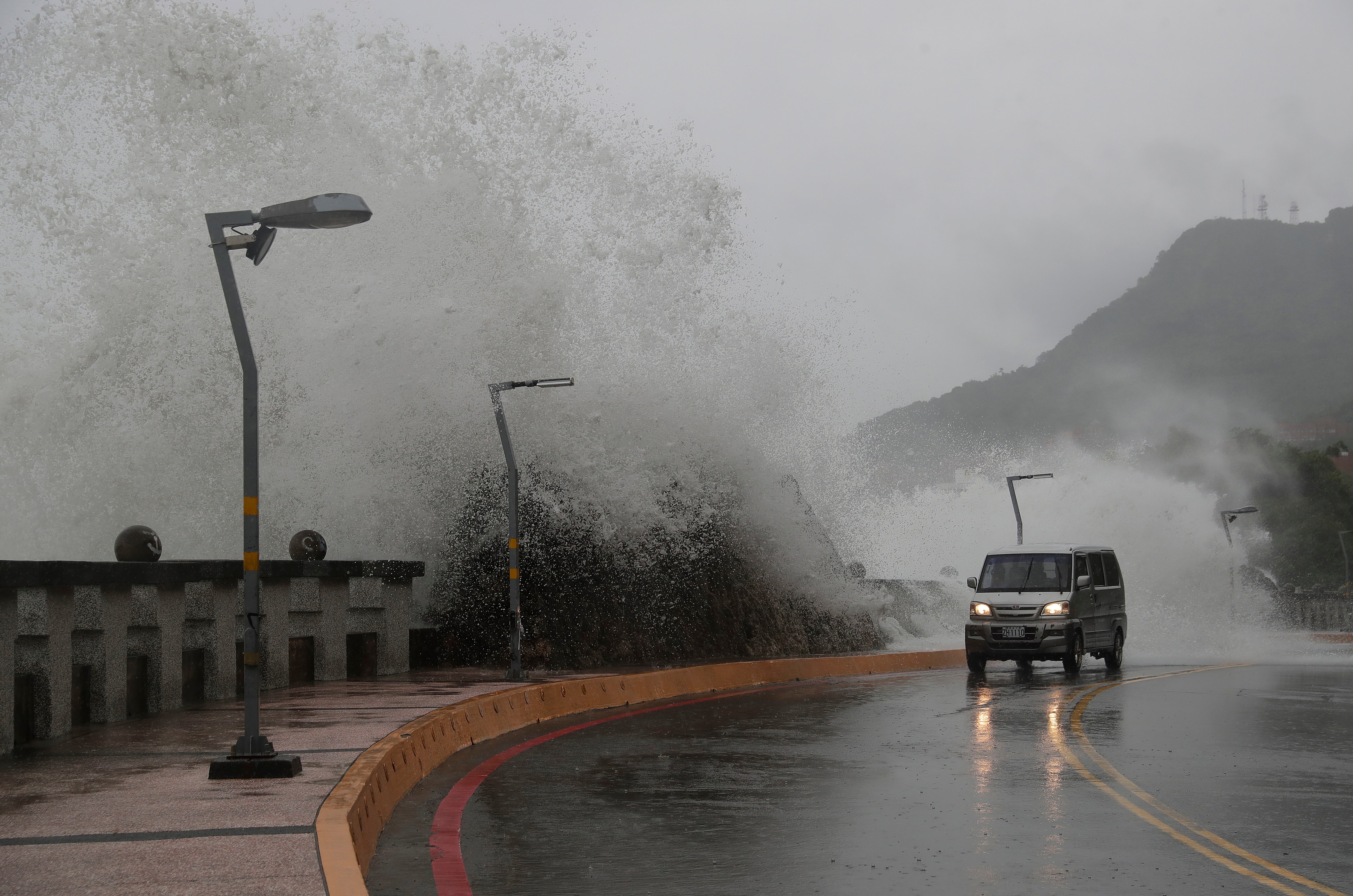 A car moves along the shore in Kaohsiung, southern Taiwan