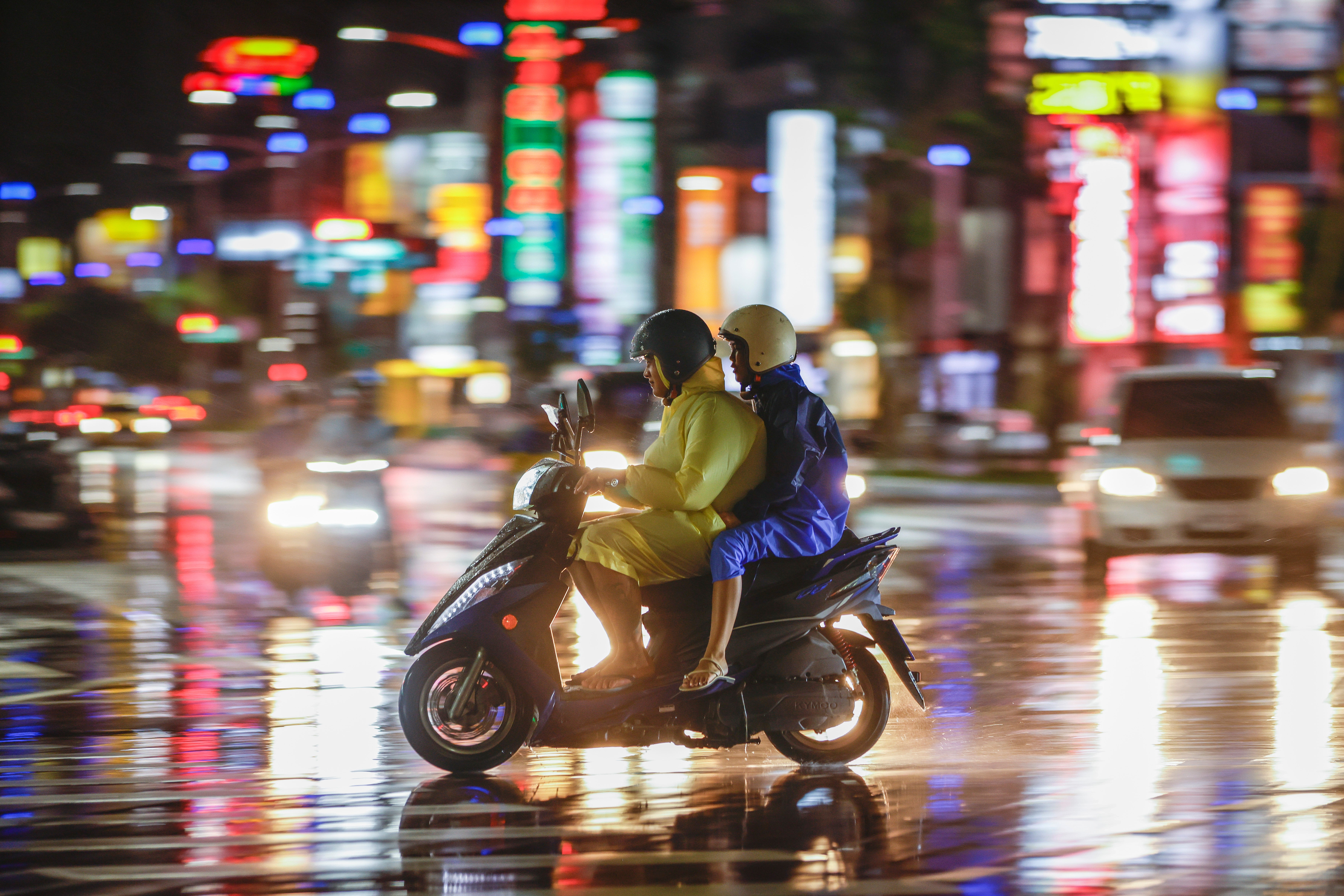 Motorists drive through the rain brought by Typhoon Krathon in Kaohsiung city, Taiwan