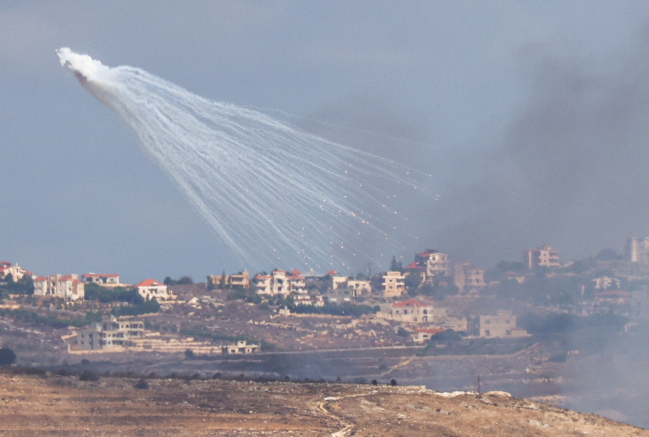 Artillery is fired by the Israeli Army into Lebanon, amid cross-border hostilities between Hezbollah and Israel, as seen from Jish, northern Israel