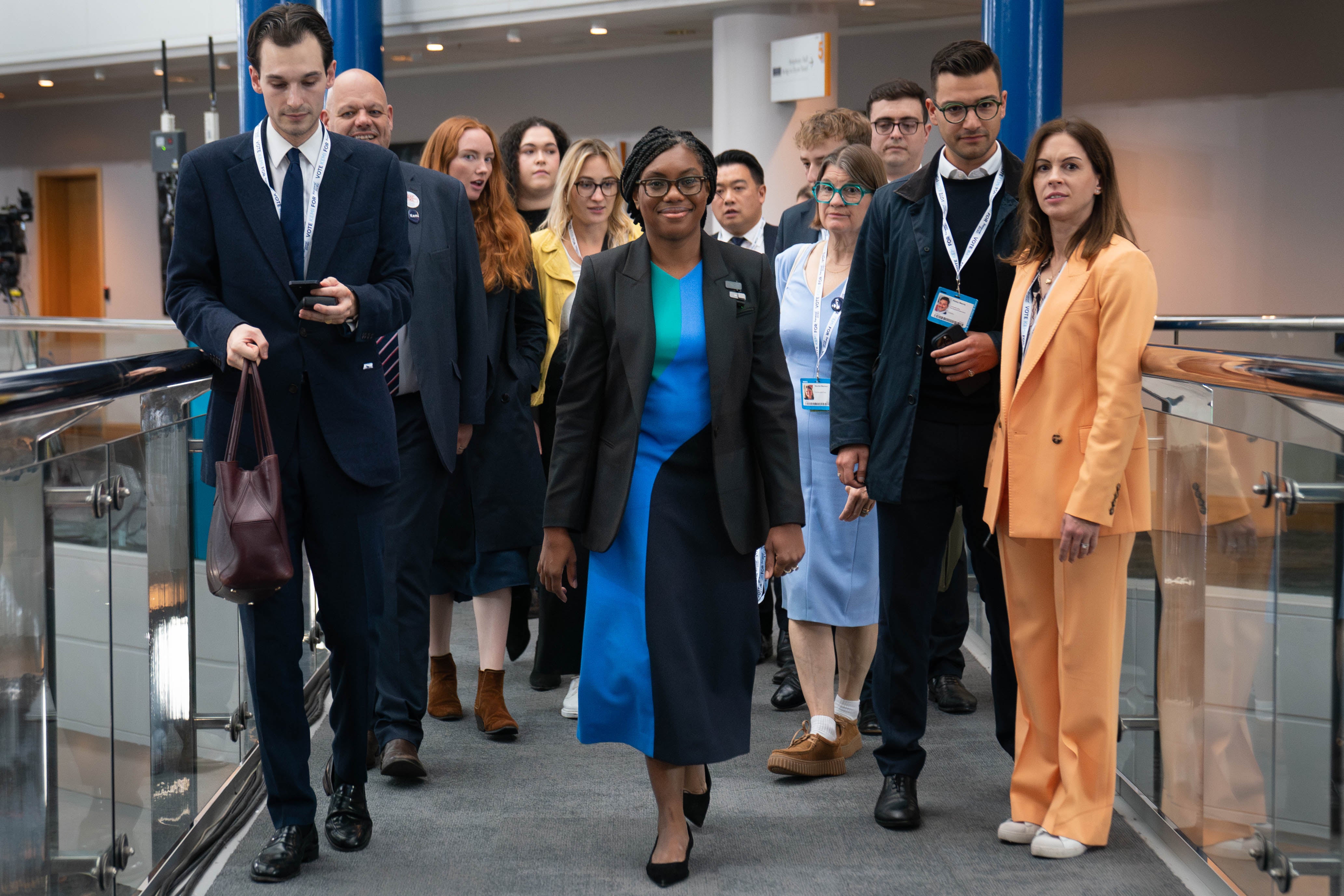 Tory leadership candidate Kemi Badenoch walks with her team through the Birmingham International Conference Centre (Stefan Rousseau/PA)