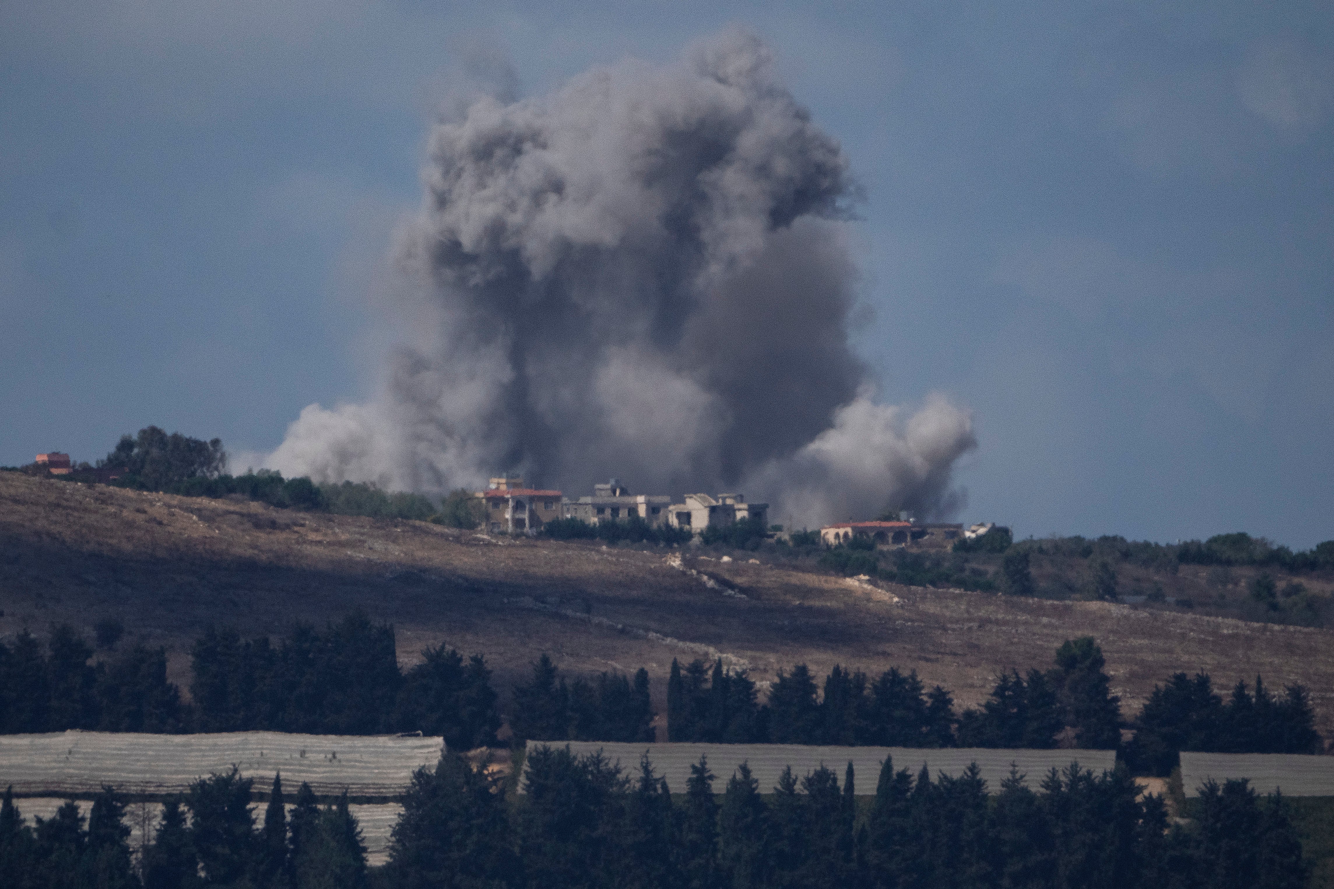 An Israeli airstrike hits an area in southern Lebanon as seen from northern Israel