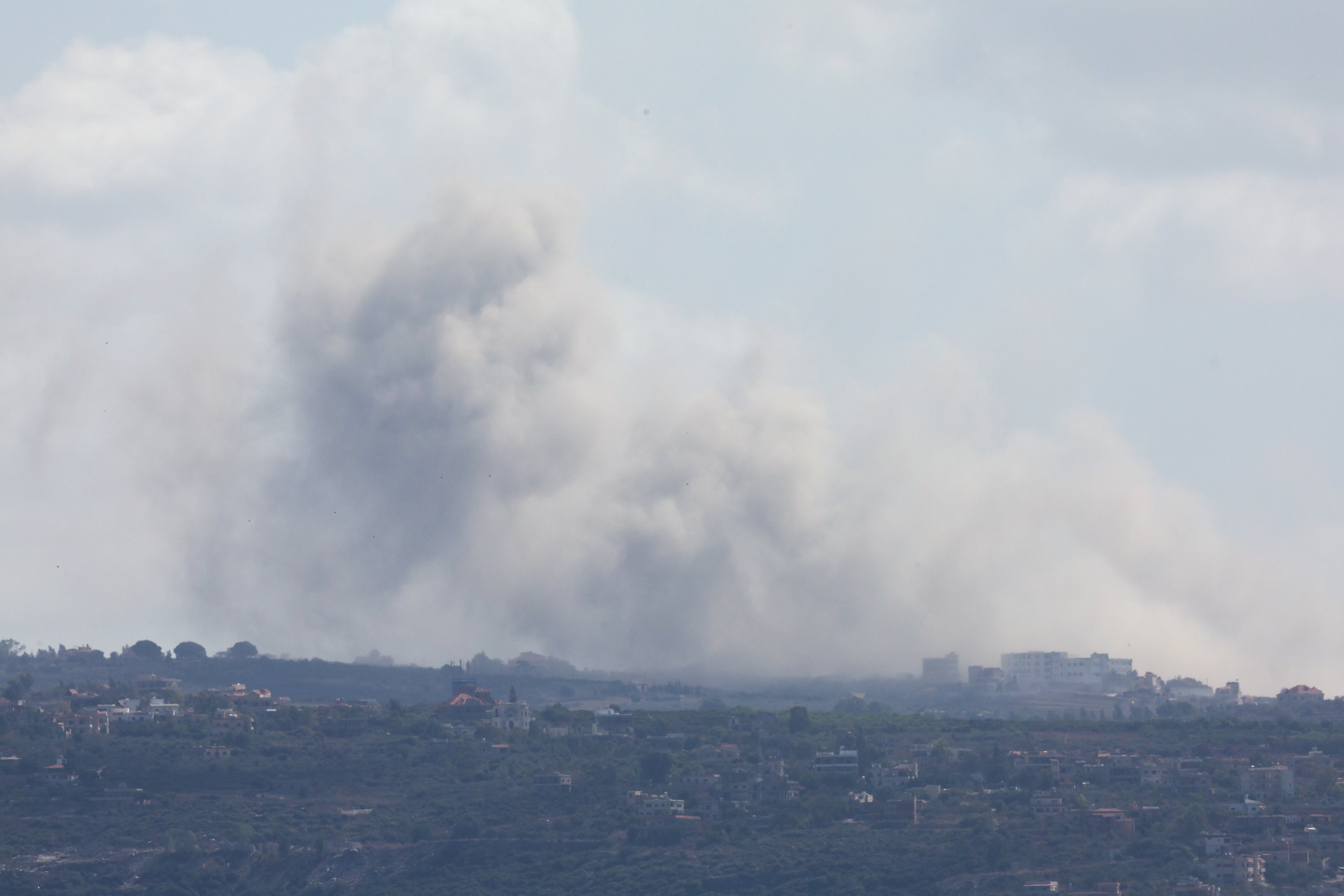 Smoke billows amid the ongoing hostilities between Hezbollah and Israeli forces, as seen from Tyre, southern Lebanon