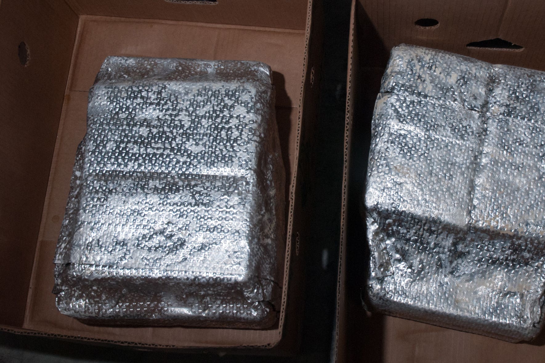 Cocaine wrapped in foil packages were found in boxes of bananas imported by the gang (COPFS/PA)