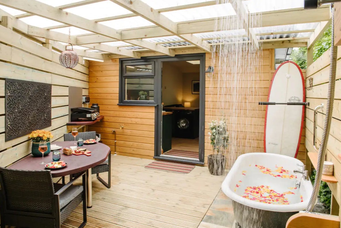 An outdoor shower and hot tub will allow you to wash away the sand completely before stepping inside