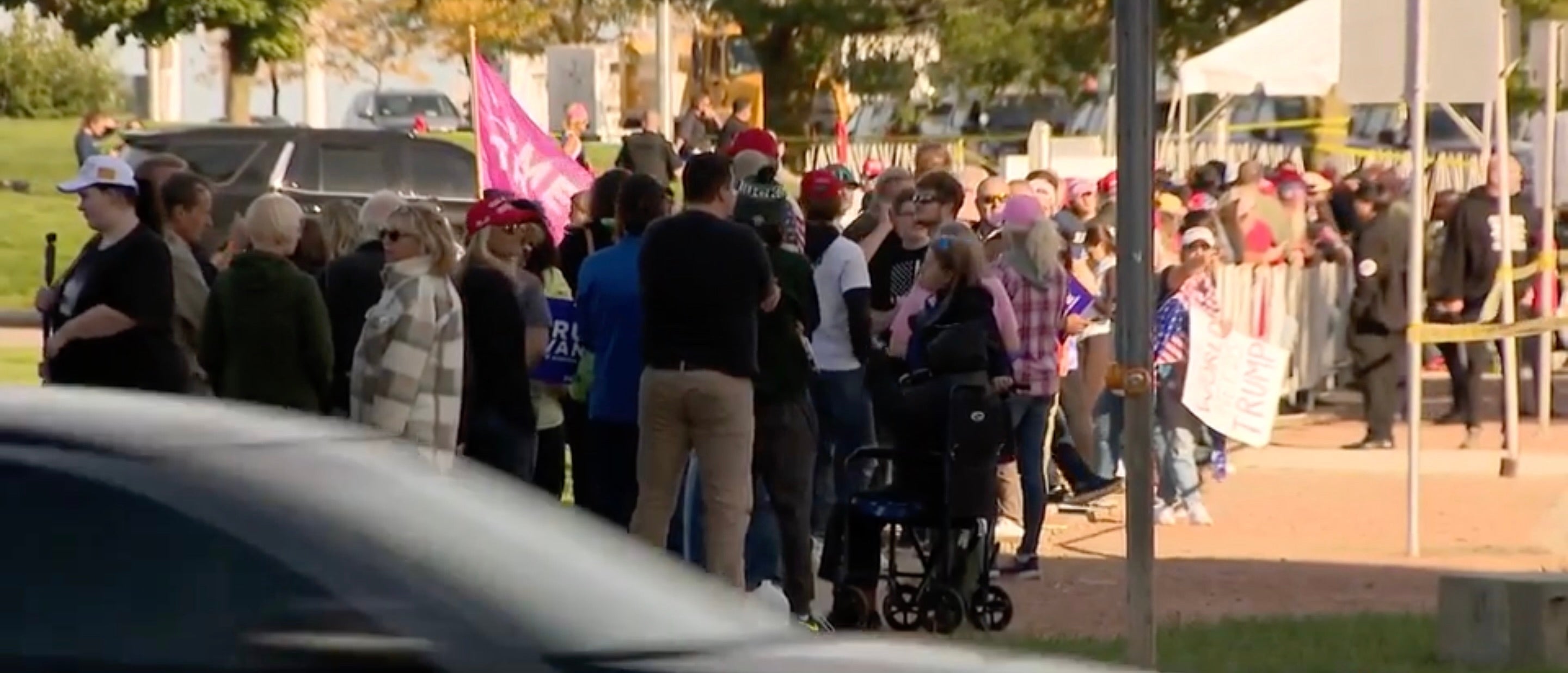 Dozens of supporters of Former President Donald Trump waiting outside Discovery World in Milwaukee on Tuesday