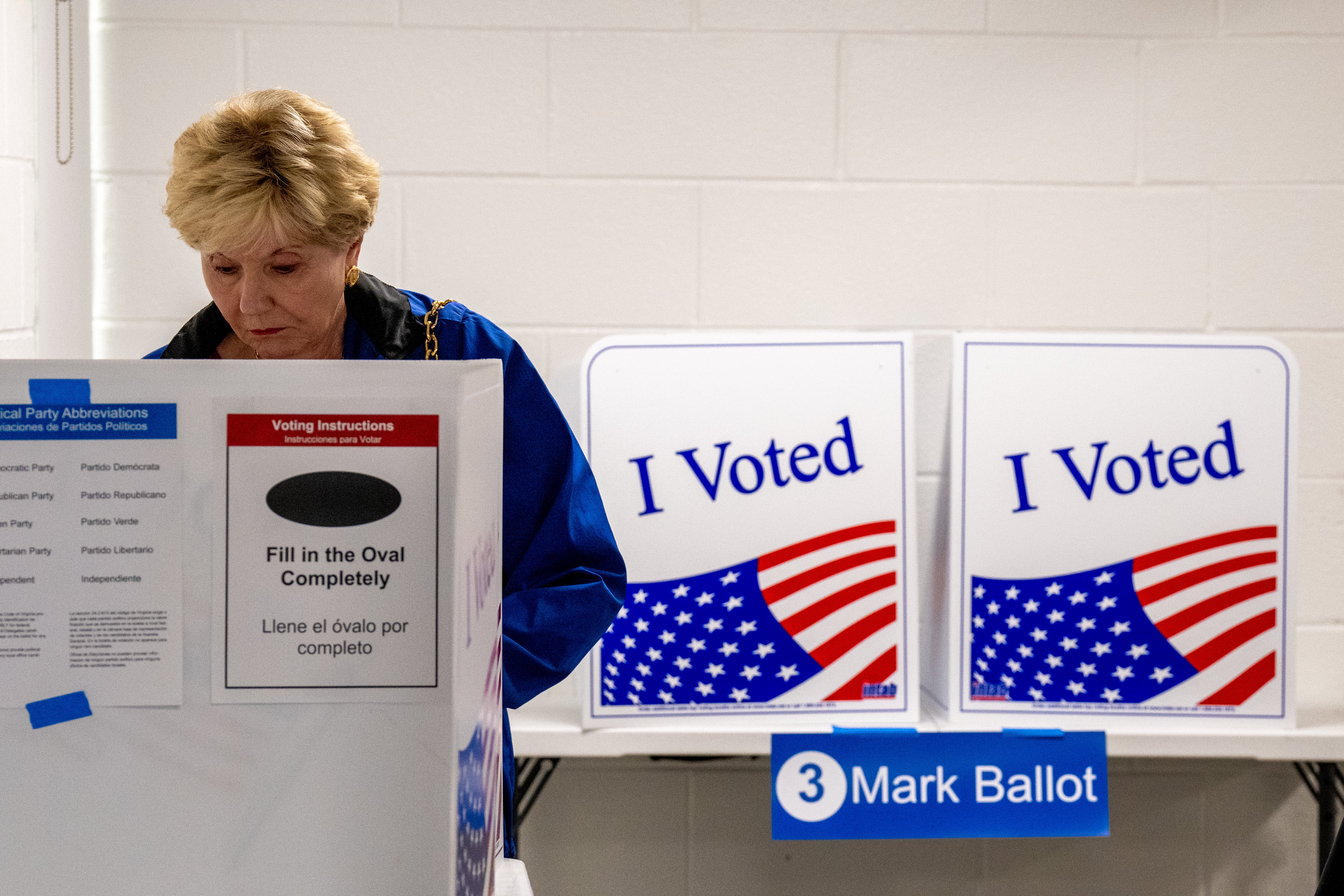 A woman votes on the first day of Virginia’s in-person early voting at Long Bridge Park Aquatics and Fitness Center on September 20, in Arlington, Virginia. Despite recent attempts at election interference, a US cybersecurity expert says election results will be secure