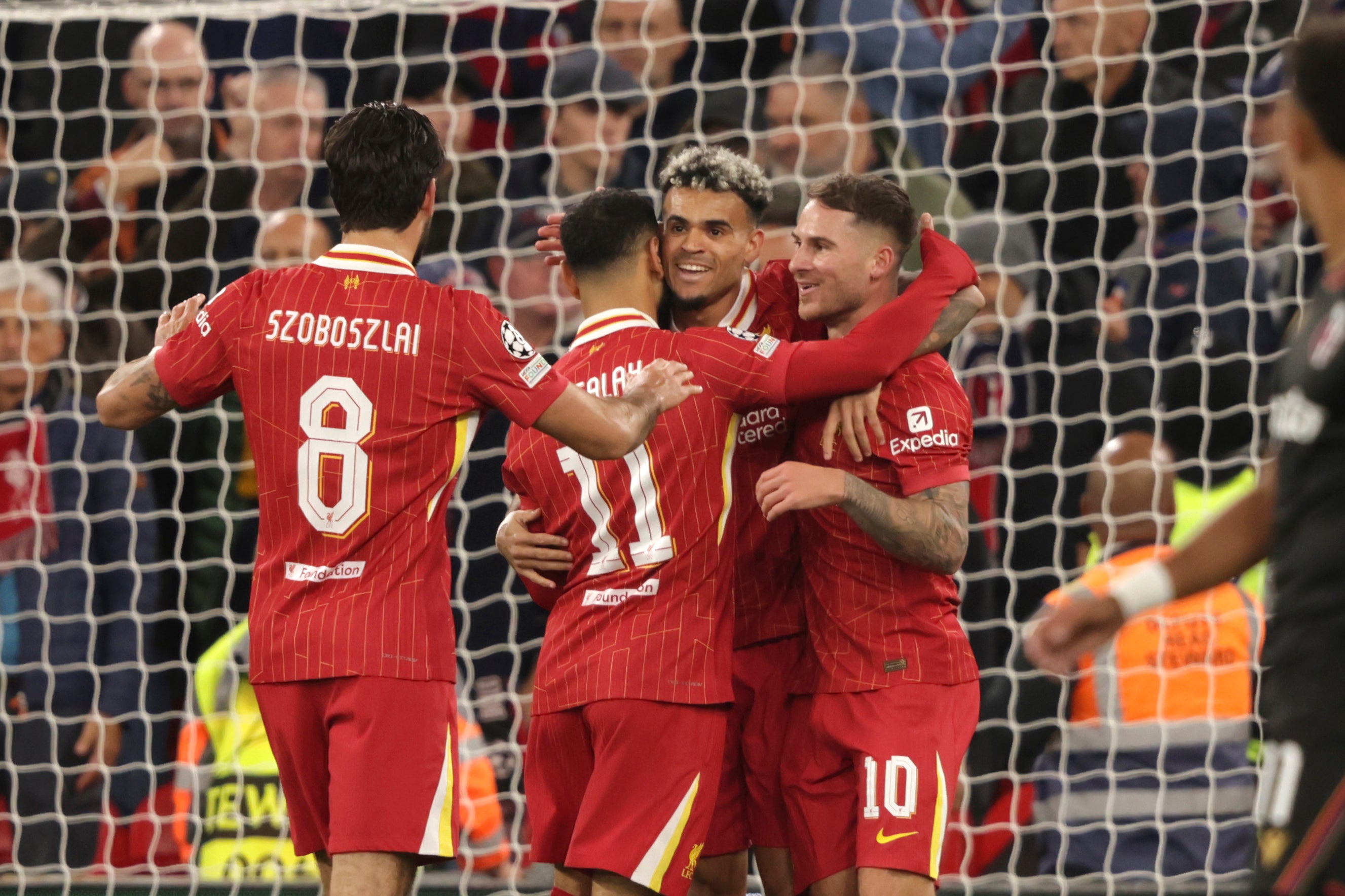 Alexis Mac Allister, centre right, celebrates after scoring his Liverpool's opening goal