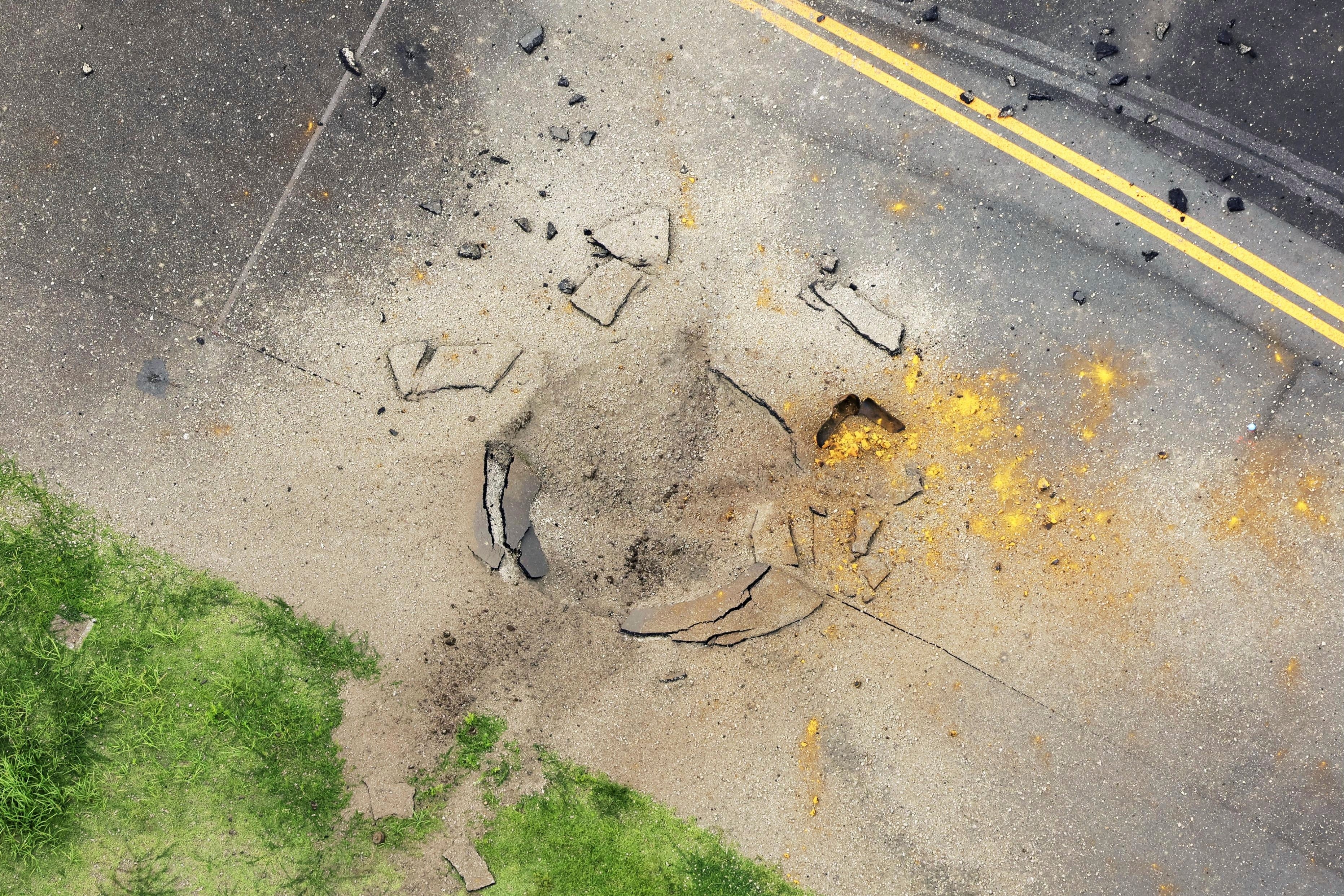 Part of a damaged taxiway at Miyazaki Airport in southwestern Japan