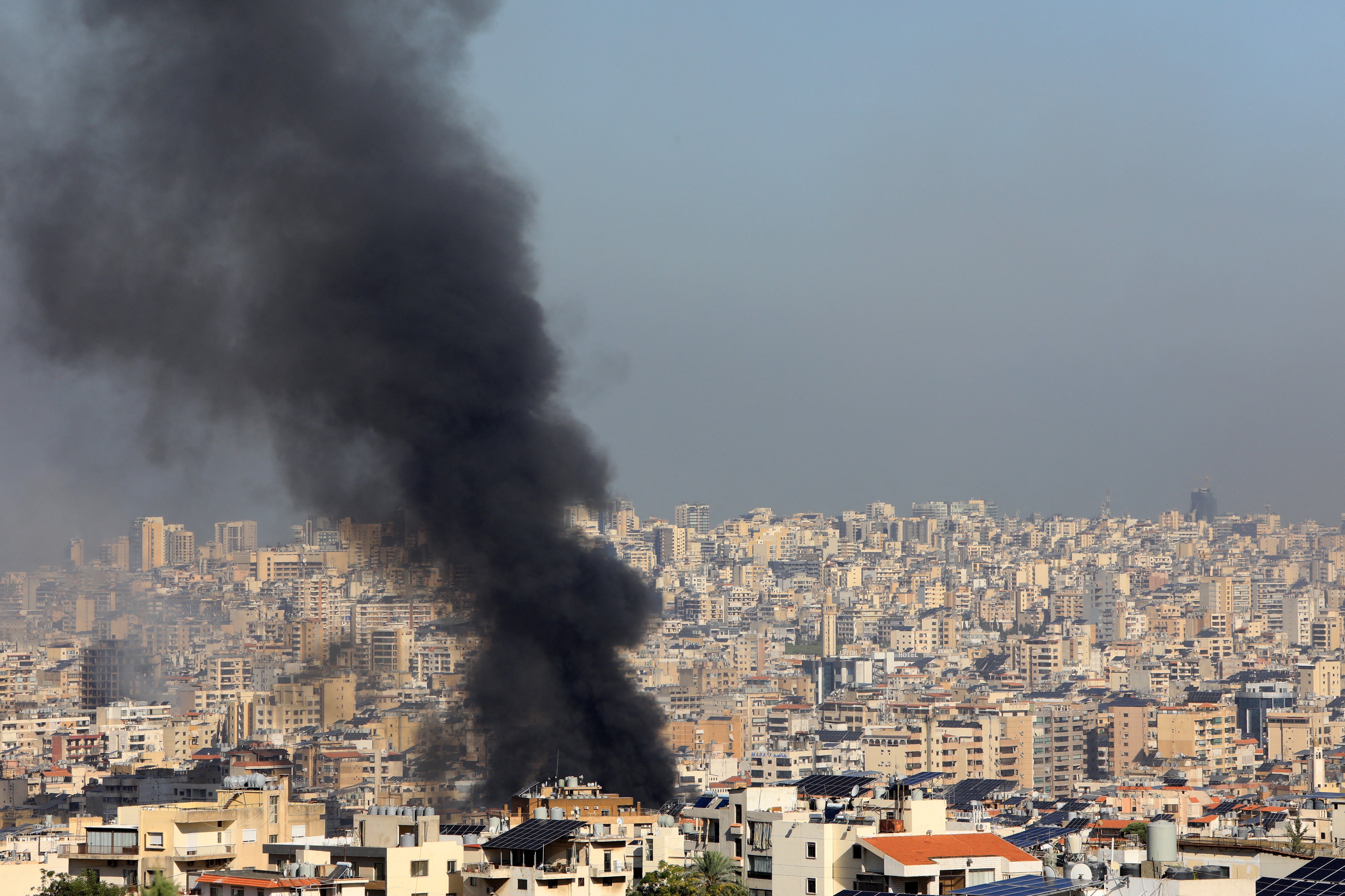 Smoke rises from buildings hit by Israeli strikes in southern Beirut