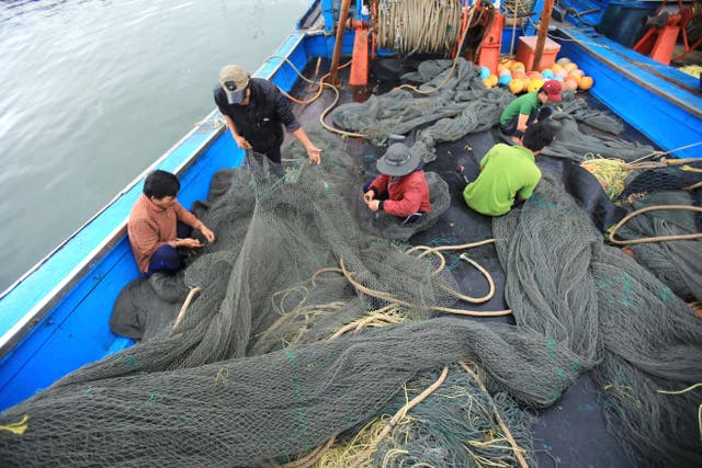 <p>File. Vietnamese fishermen fix nets on their boat while docked at Tho Quang port, Danang, after a trip in the South China Sea, on 27 March 2016   </p>