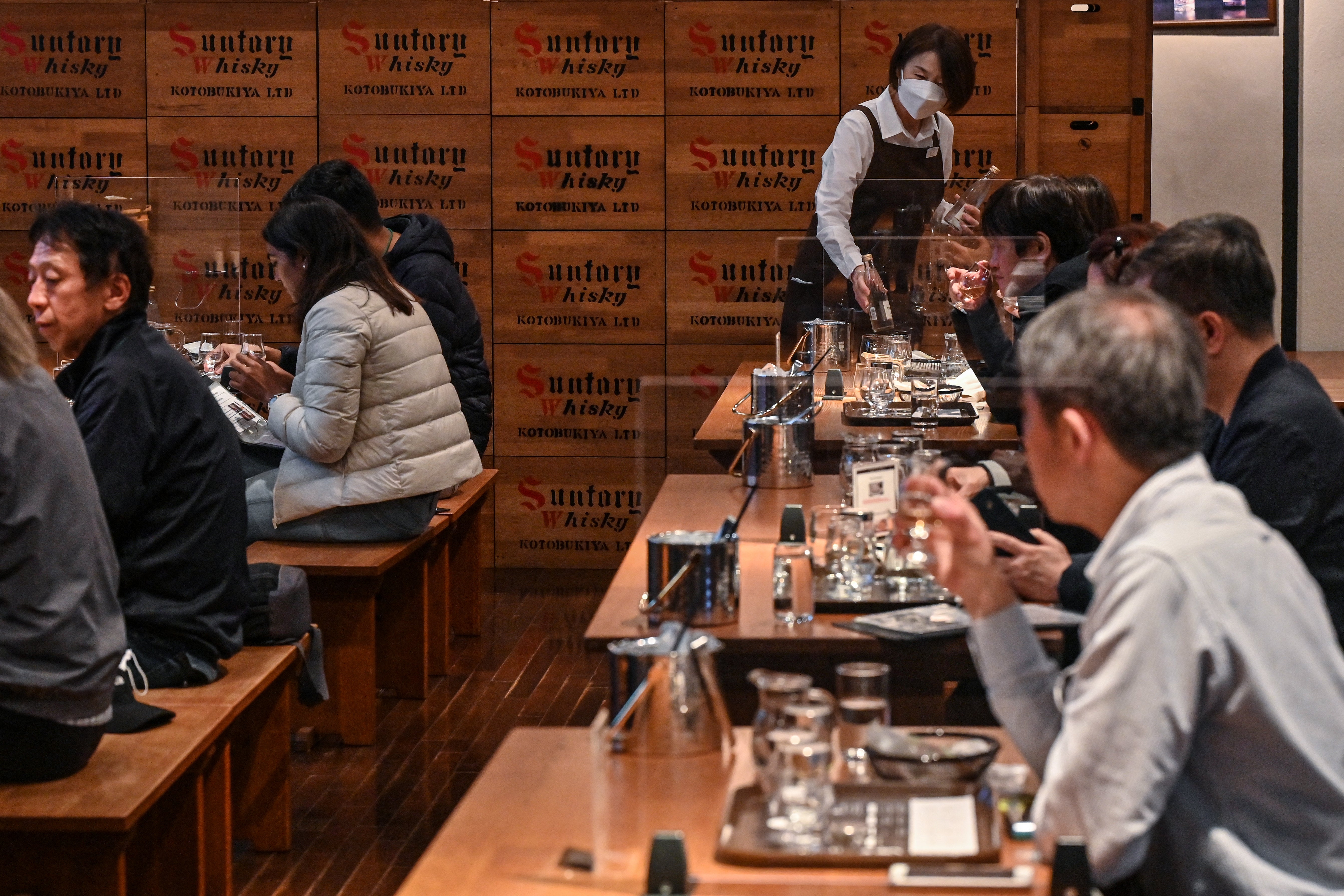 Visitors taking part in a whisky tasting course at the Suntory Yamazaki Distillery