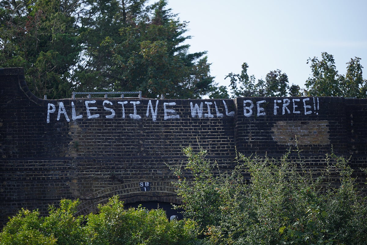 Graffiti sprayed on a railway bridge in Golders Green, north London