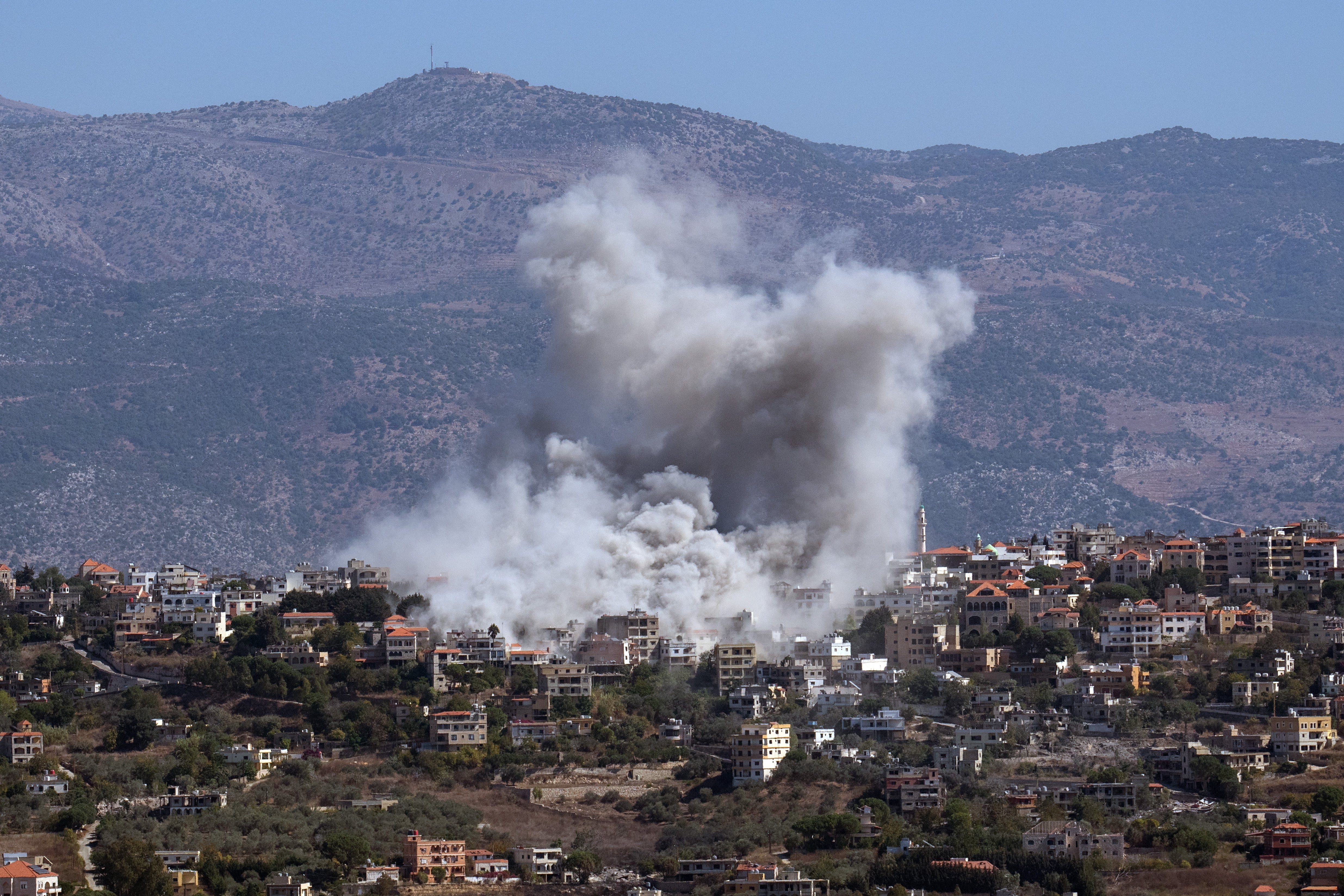 Smoke rises from the site of an Israeli airstrike on the town of Khiam on Thursday