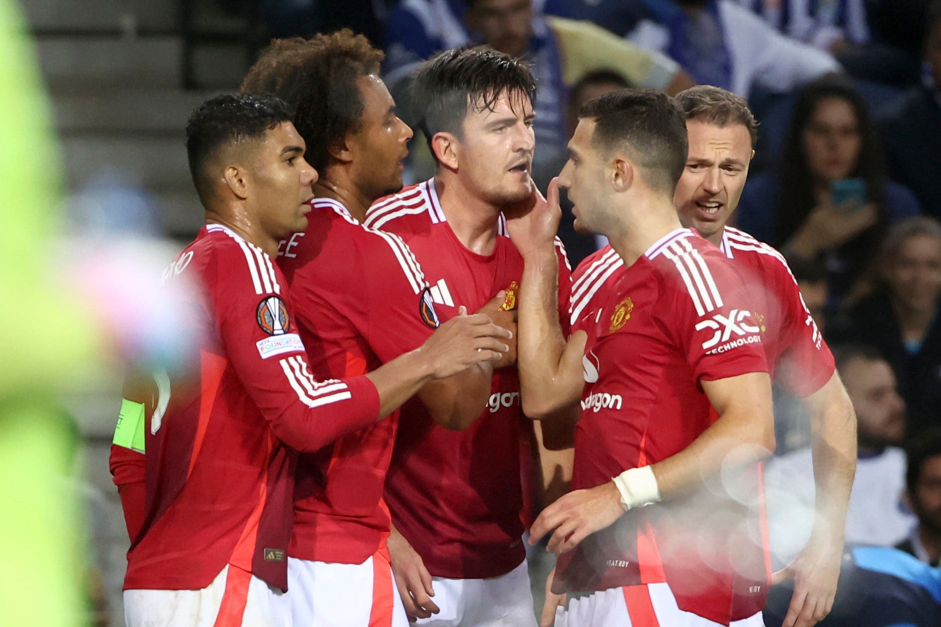 Harry Maguire, centre, earned Manchester United a draw with a late goal (AP)