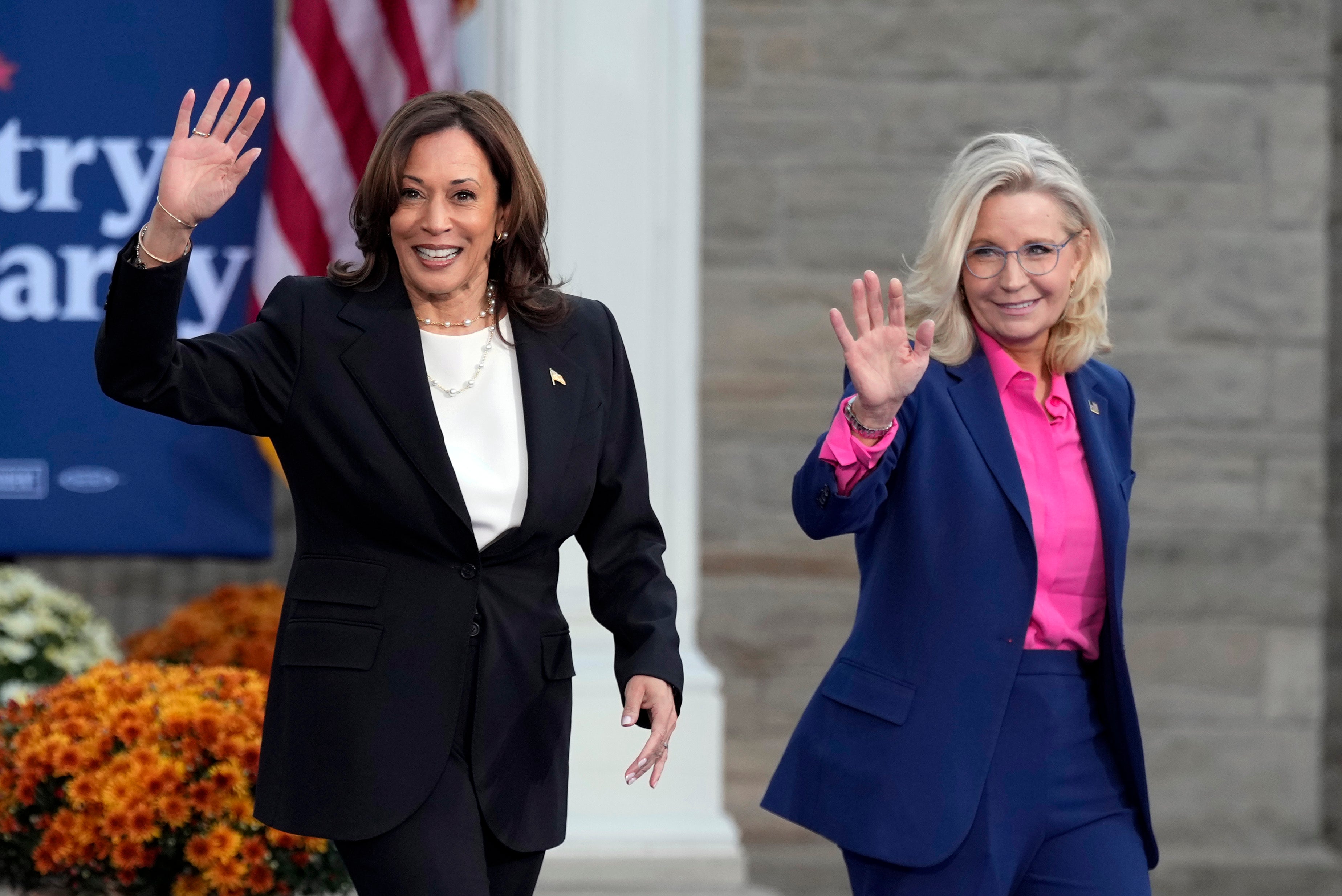 Kamala Harris walks with Liz Cheney at a campaign rally at Ripon College, Wisconsin