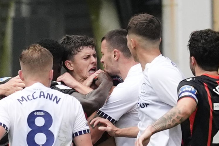 Blackburn Rovers' Owen Beck being confronted by Preston North End's Milutin Osmajic