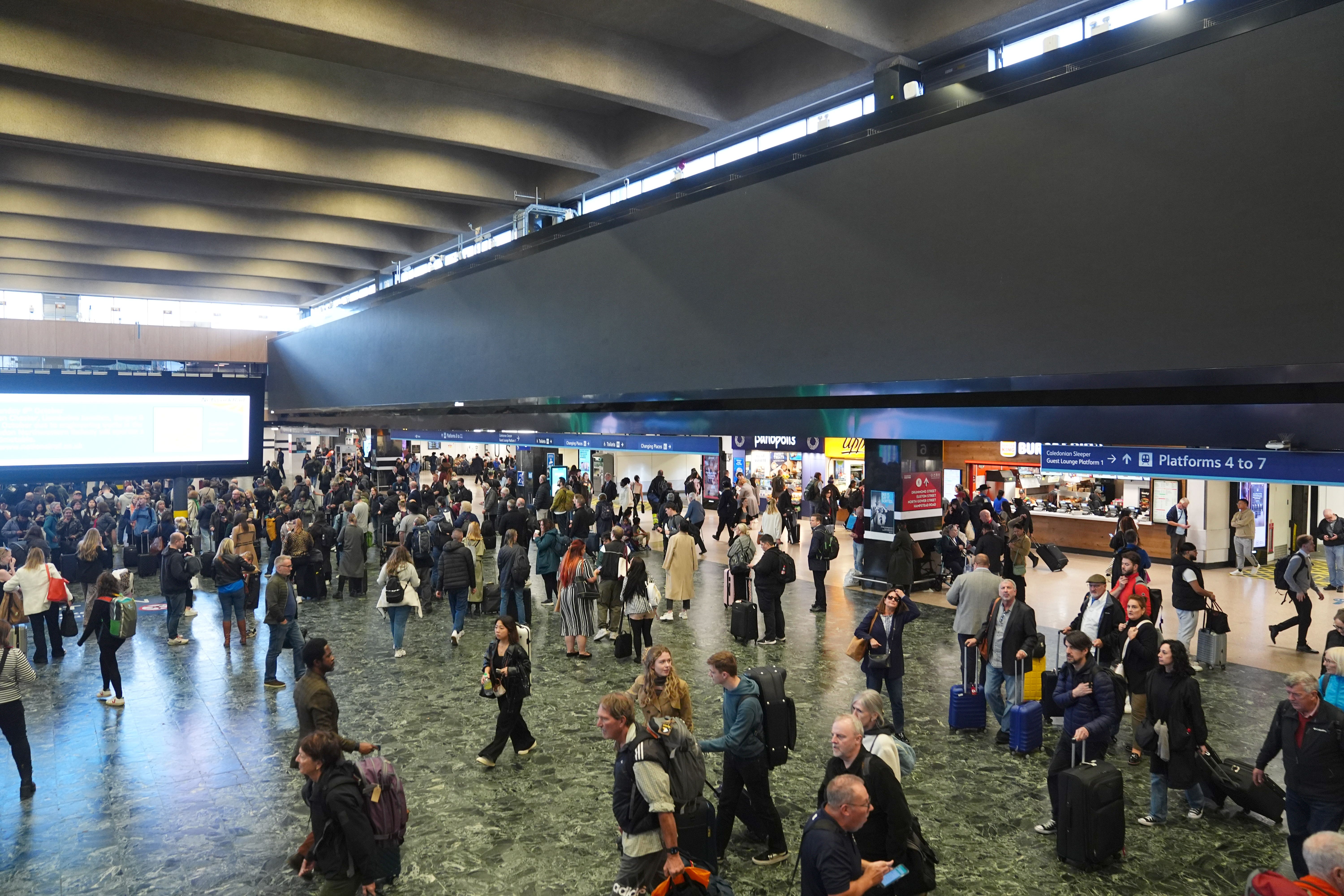 Network Rail has turned off a large advertising board at London’s Euston station following criticism it made the passenger experience worse (James Manning/PA)