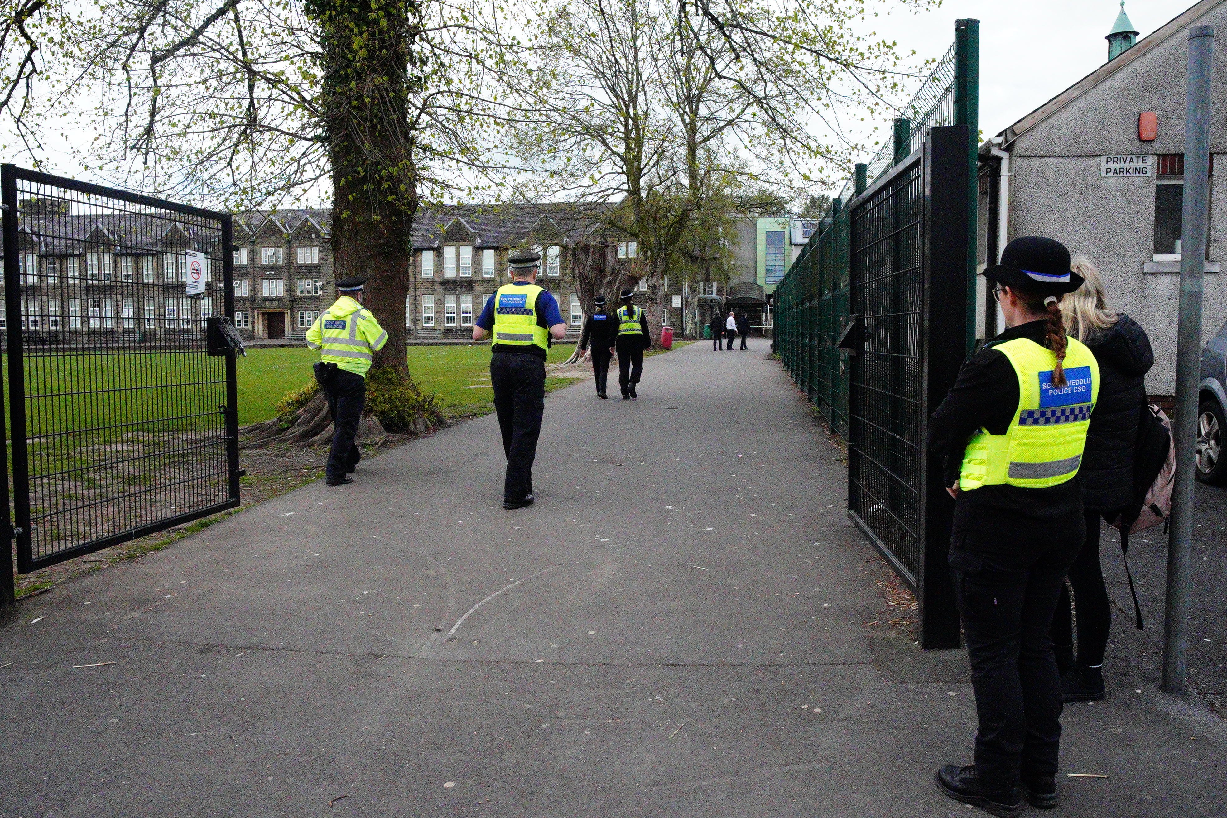 Police officers outside Amman Valley school in Ammanford, Carmarthenshire (Ben Birchall/PA)