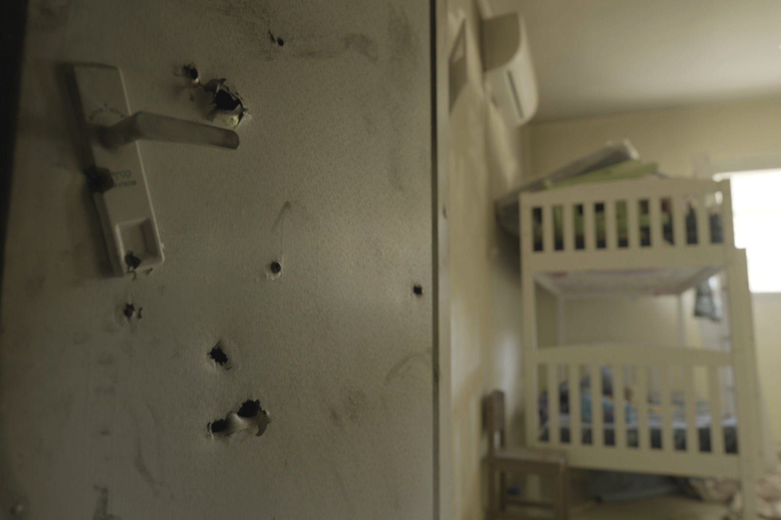 Bullet holes left in a child’s bedroom wall by Hamas terrorists