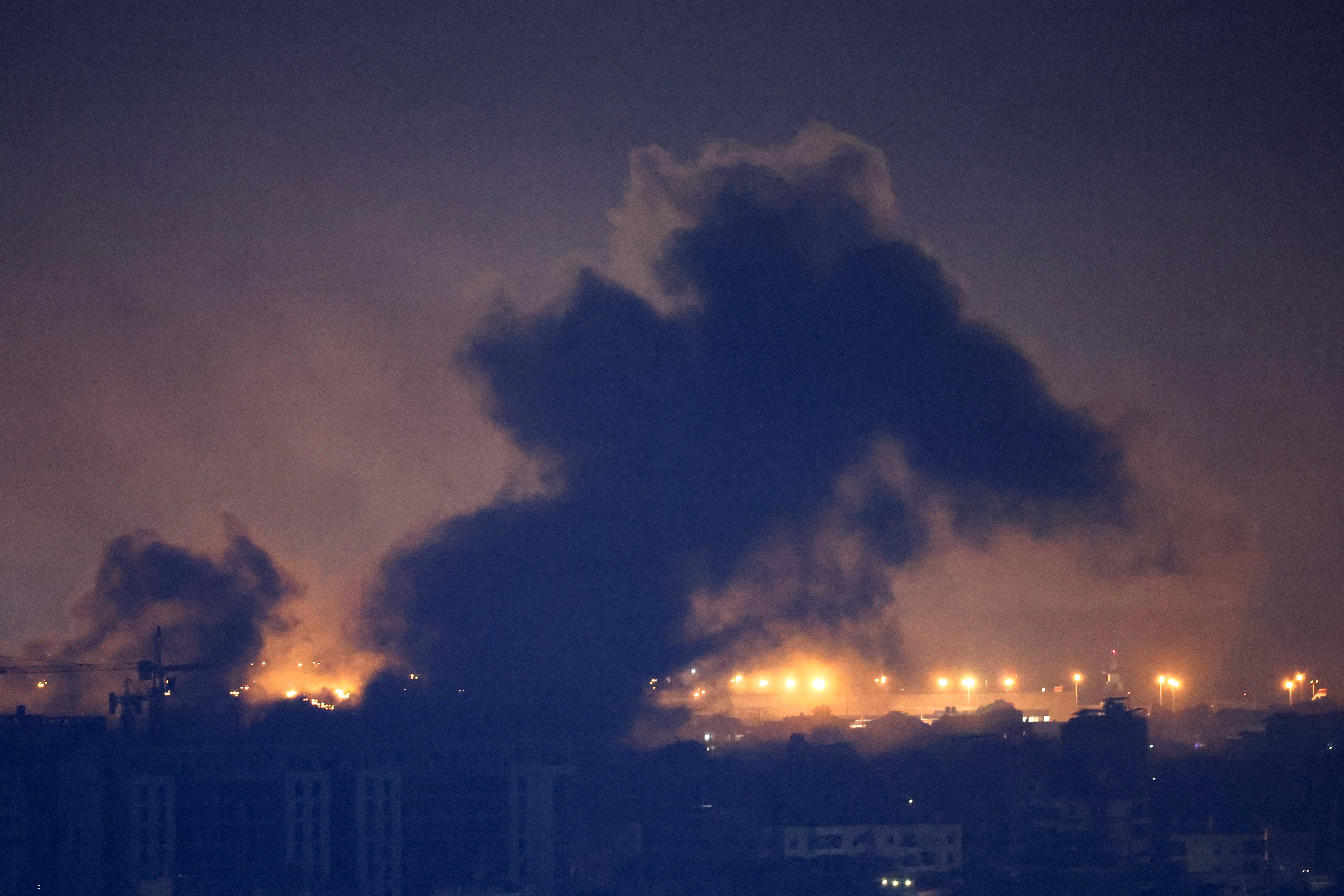 Smoke billows over Beirut's southern suburbs after a strike, amid ongoing hostilities between Hezbollah and Israeli forces