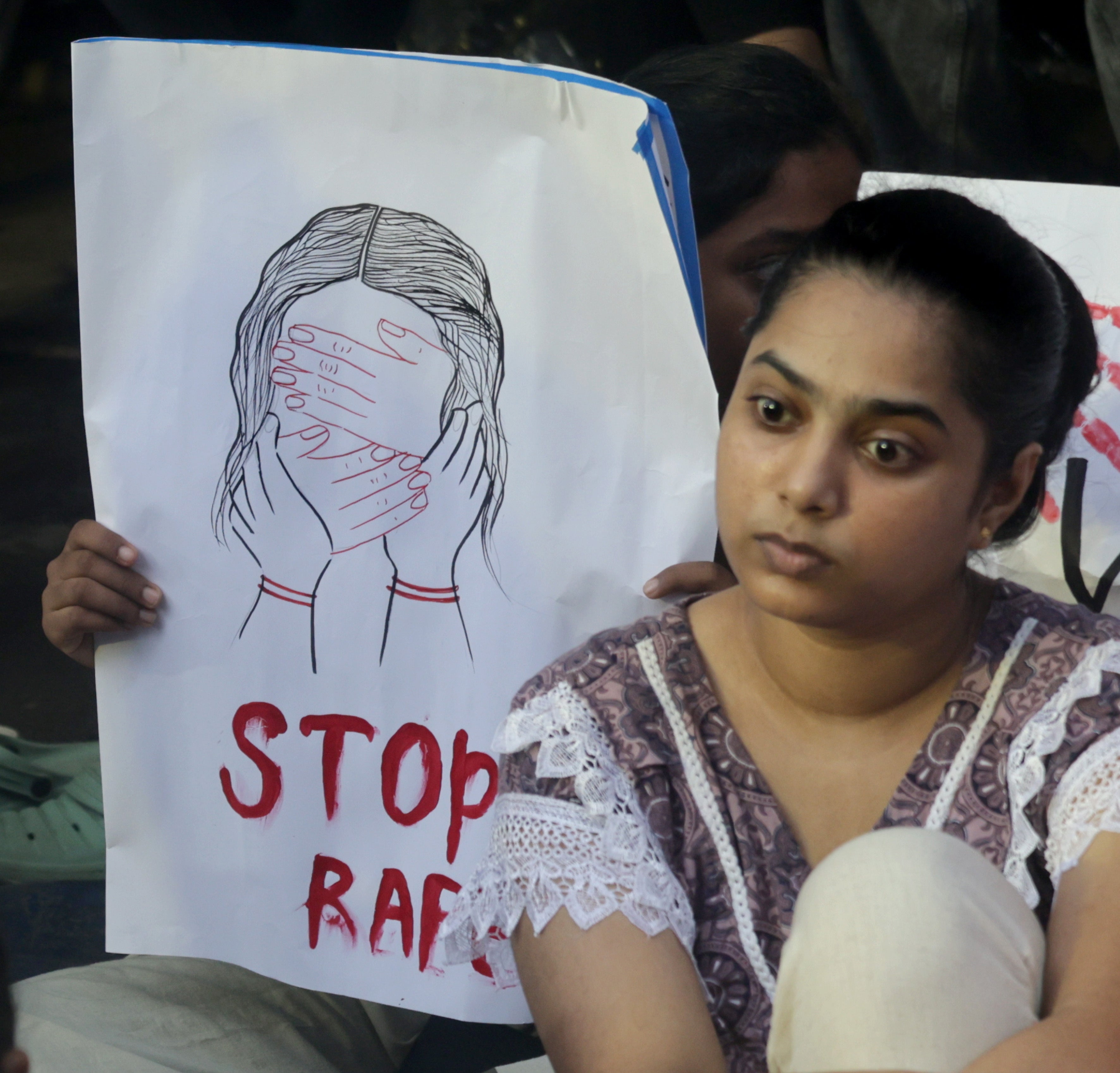 Protester attends a protest against rape and murder of doctor in Kolkata