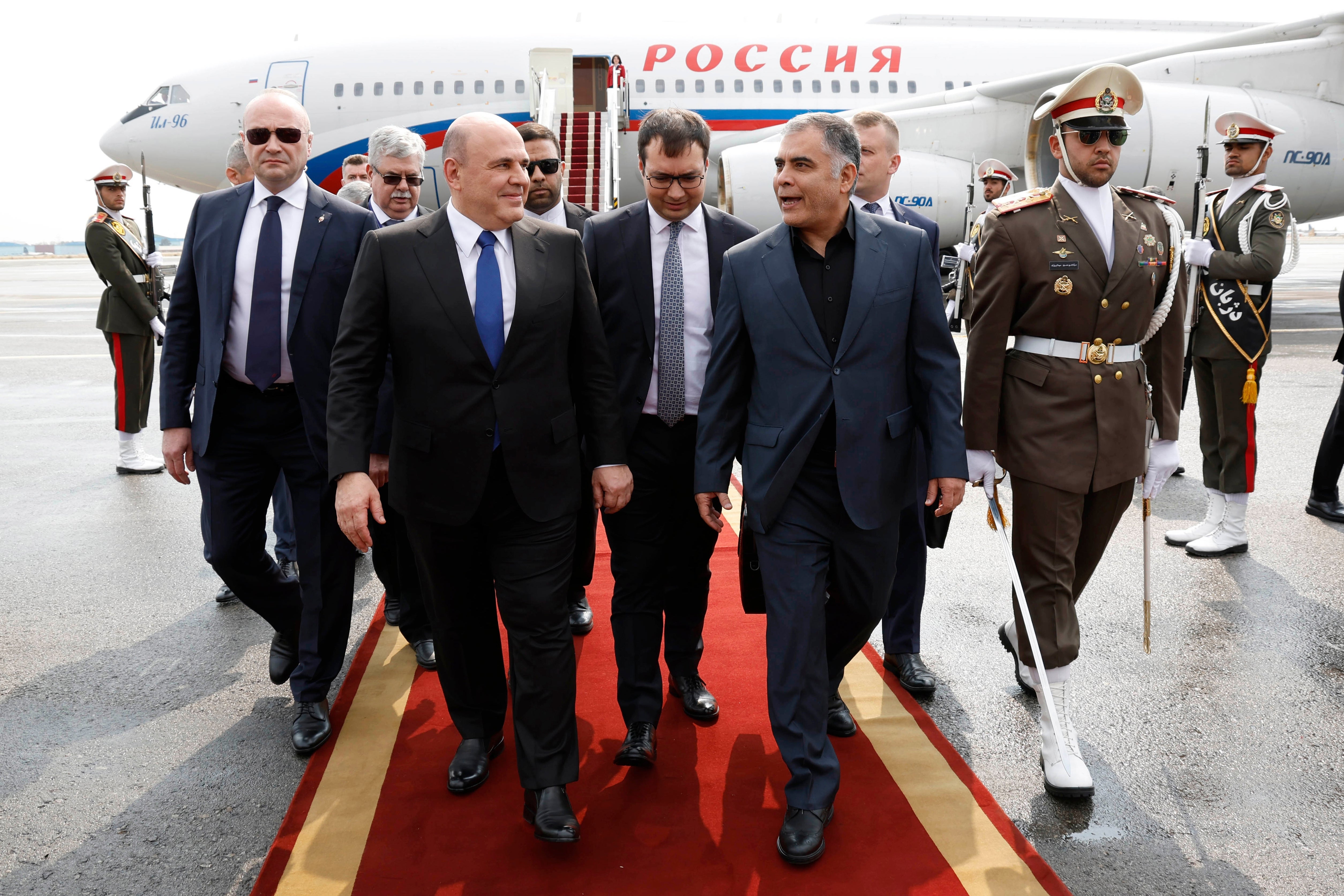 Russian Prime Minister Mikhail Mishustin, left, meets Iranian Oil Minister Mohsen Paknejad upon arrival in Tehran last month